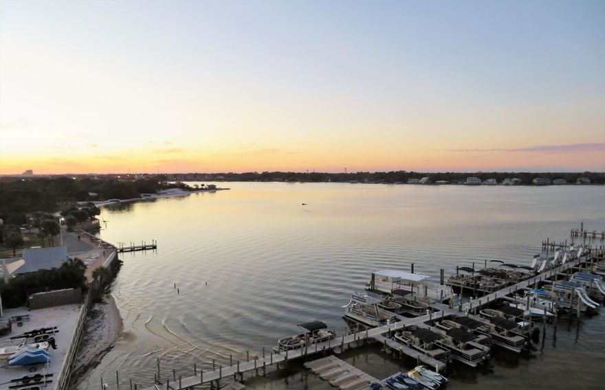 Premier Vacation Rental Machine with Over 99K on the Books for this Yr. Penthouse Suite with Sweeping Views of the Bay & Gulf of Mexico! This Luxurious Condo on the top floor is a Western facing Superb location boasting Amazing Sunsets & views as far as the eye can see! Endless Entertainment All Around you, no need to drive! Enjoy High End Furnishings while relaxing inside with Views from Every room! Step out onto the expansive balcony and climb the spiral staircase to your own private Roof Top Terrace hosting a 4 person Hot Tub & Grill area, Watch the Fireworks from your terrace weekly! Amenities at Destin West include, Lazy River, 6 heated pools, fitness center, private beach and sky way bridge to safely transition from the bay side to the gulf side of the property!