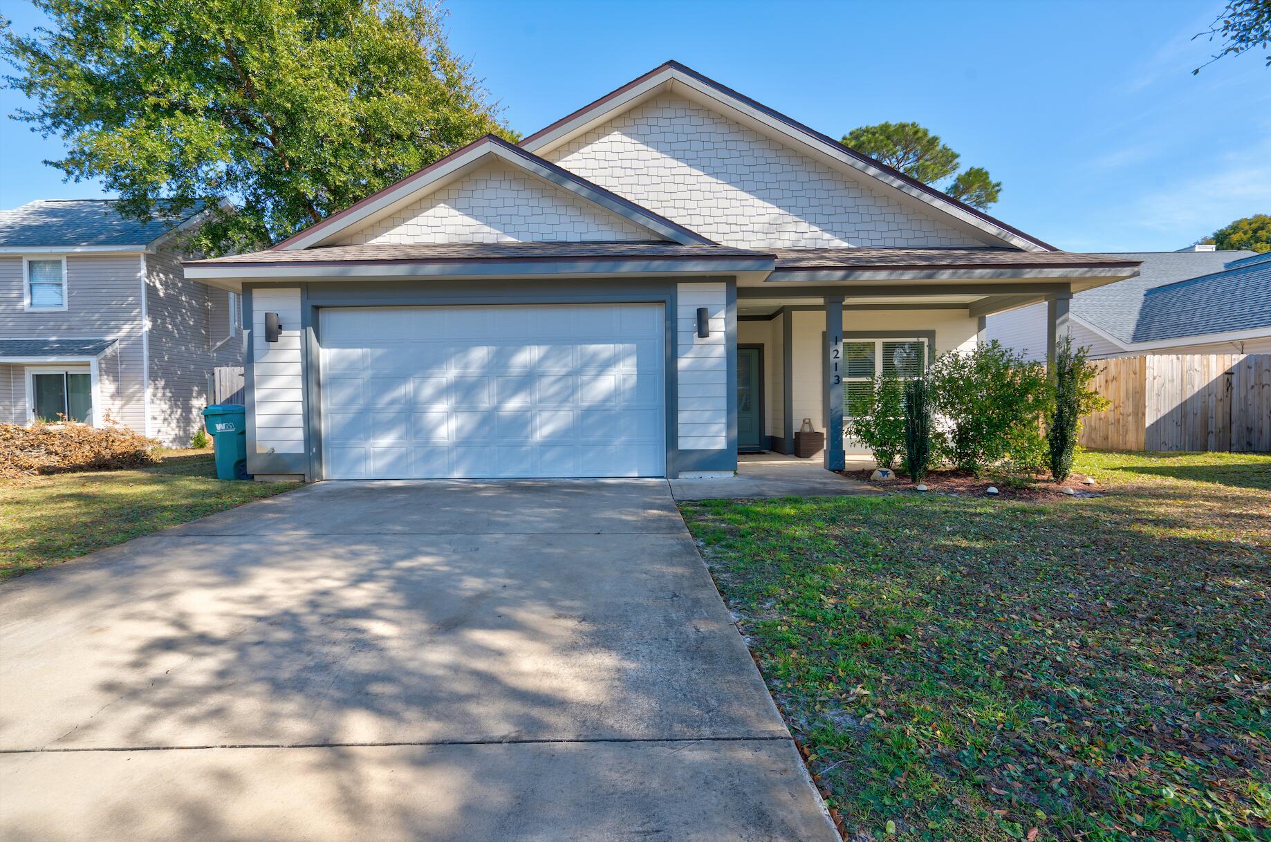ATTENTION ALL VA BUYERS: 2.25% ASSUMABLE VA LOAN! Stunning Lakefront Home in the Heart of Destin! This home built in 2021, is a rare find, offering impeccable craftsmanship and thoughtful design throughout. Exterior features include Hardie lap siding, craftsman-style trim, a welcoming front porch, and a large screened-in back porch overlooking the serene lake. The fully landscaped, fenced-in yard is enhanced by a retaining wall at the water's edge, creating a picturesque outdoor retreat. Inside, the open-concept floor plan is filled with natural light, complemented by vaulted ceilings and luxurious finishes. Highlights include quartz countertops, custom cabinetry, stainless steel appliances, LVP flooring, and a shiplap accent wall in the living room.
