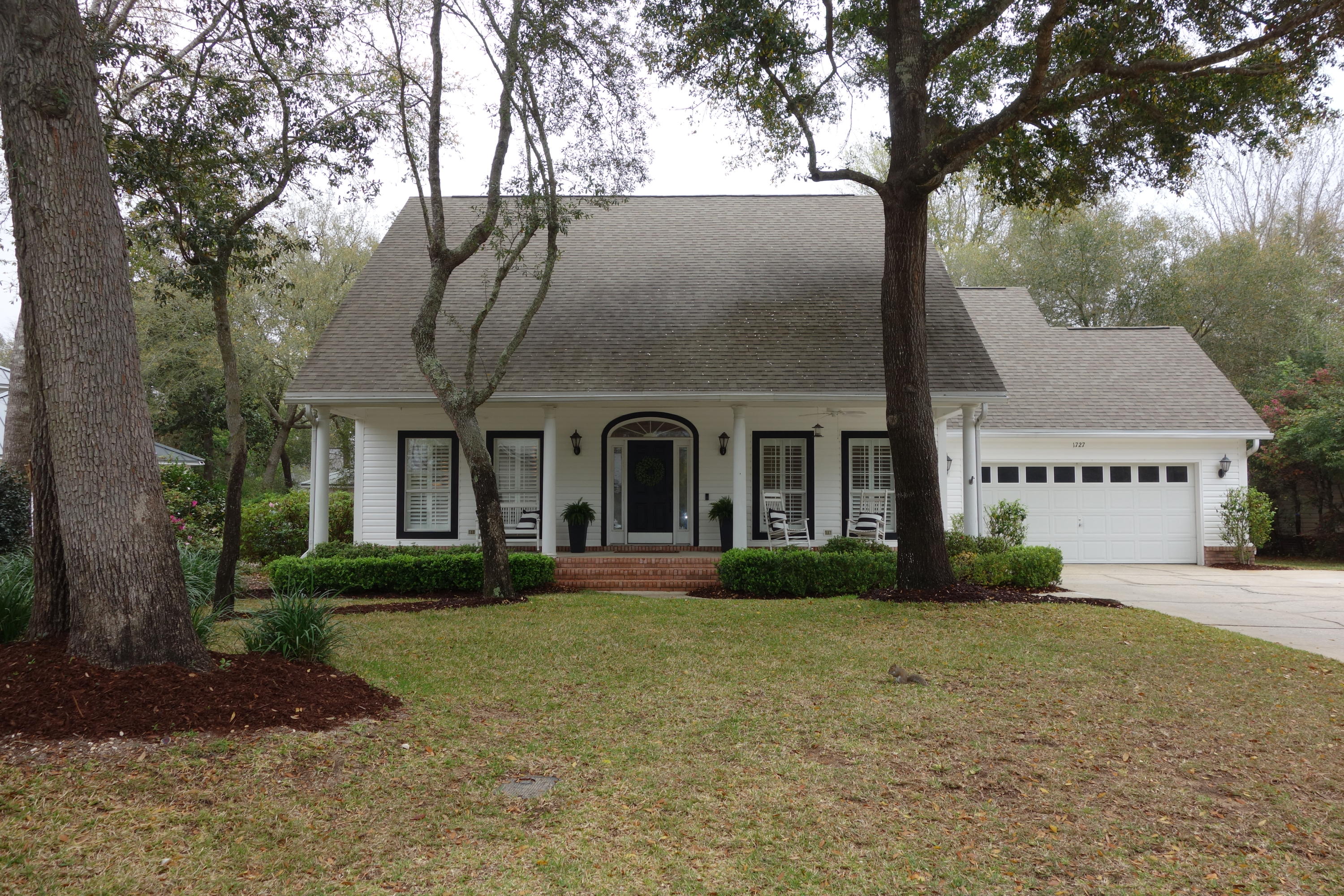 Bolton Village Beauty! This 4-bedroom 31/2 bath house located in the gated community of Parkwood Estates has been renovated and is a must see! Step inside the welcoming foyer and you will see the beautiful new staircase, but your eyes will be drawn to the family room with the redone farmhouse fireplace finished with shiplap! The fireplace is flanked by two floor to ceiling windows that flood the room with light. The family room is now open to the beautifully redone kitchen and breakfast nook for open sight lines. The kitchen has new white cabinets, Caesarstone quartz-Calacatta Nuvo countertops, gas stove, state of the art 64'' stainless steel refrigerator, and a white subway tile backsplash with a custom vent hood.