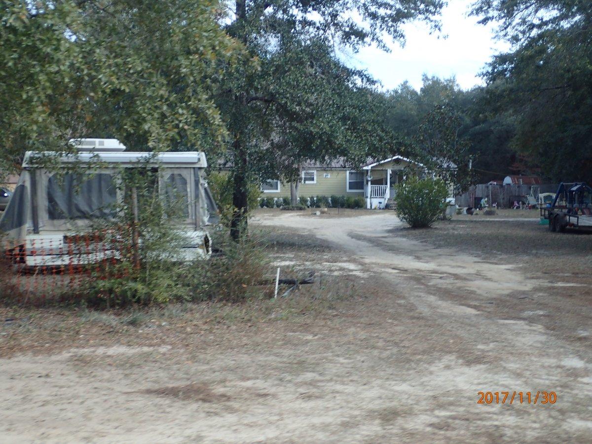 This REO auction property is located on just over 5 acres and is minutes from town. Home is a 1992 mobile home with 3 bedrooms and 2 baths. Please refer to auction terms. Asking price: $75,000.