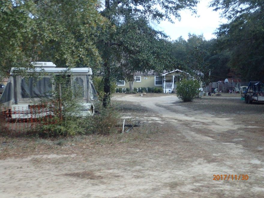 This REO auction property is located on just over 5 acres and is minutes from town. Home is a 1992 mobile home with 3 bedrooms and 2 baths. Please refer to auction terms. Asking price: $75,000.