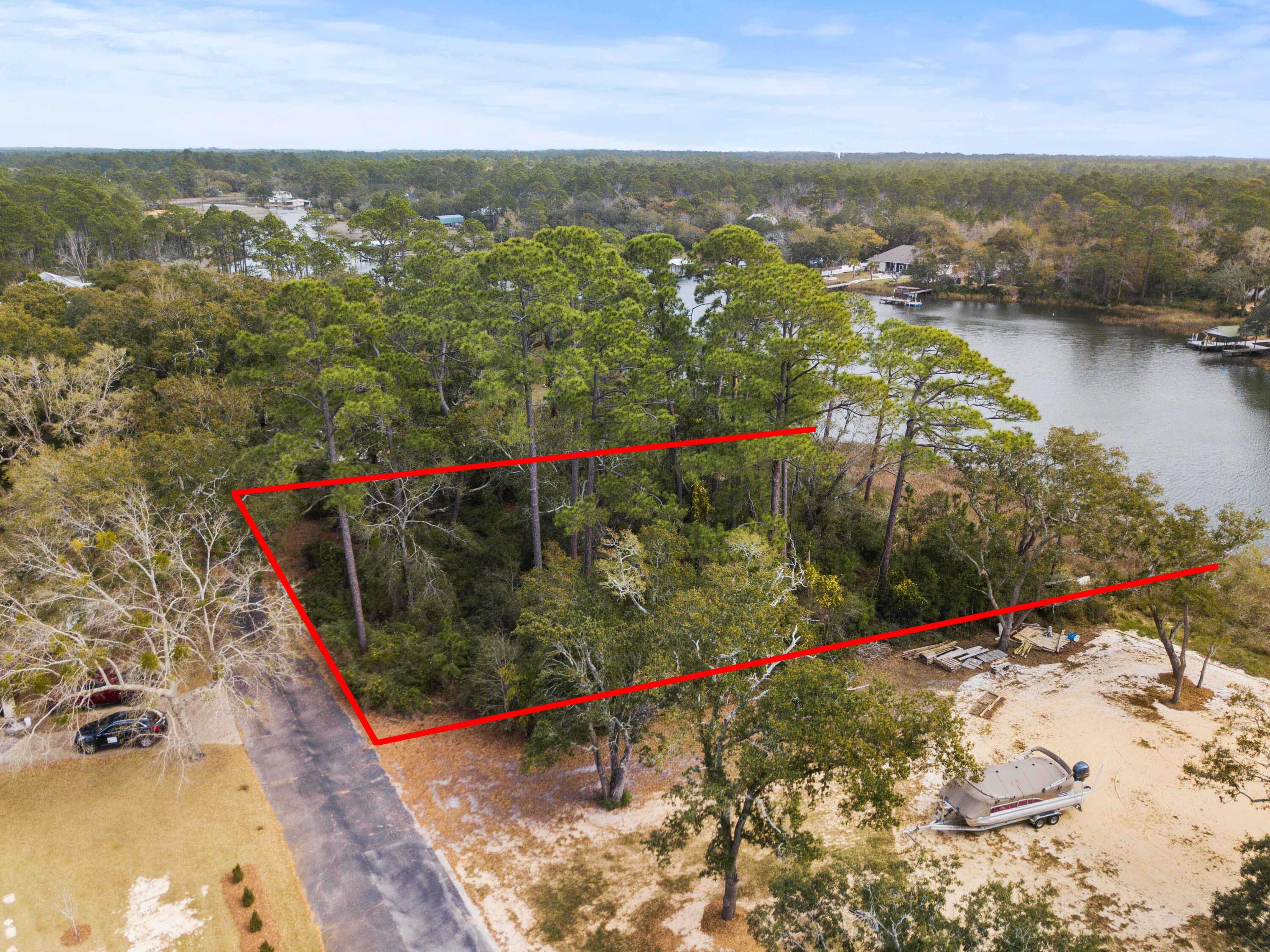 Amazing waterfront vacant piece of land to build your dream home on Garcon Point! So close to I-10 for easy access to Pensacola and Crestview. Bring your boat and easily get to all of the surrounding Bay areas. Do not miss a chance to develop your water paradise today!