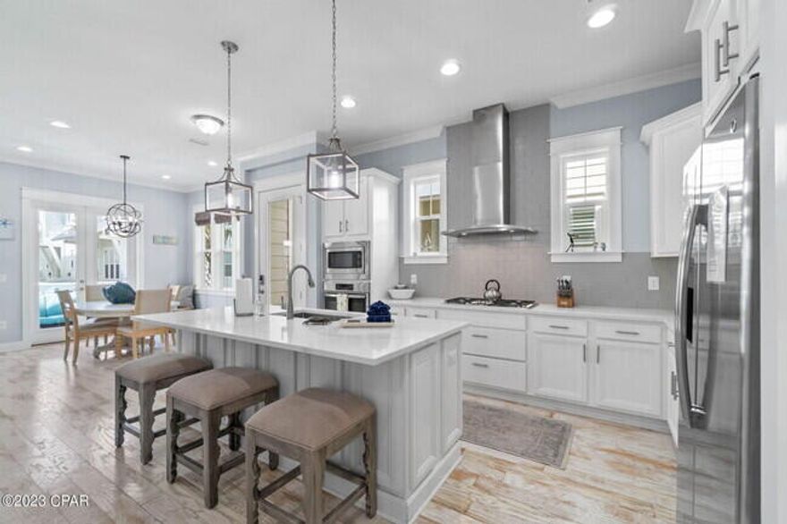 This 5-star rated, Superhost-listed 3-bedroom, 2.5-bathroom villa in Prominence North is a B type unit that is upgraded with hardwood floors everywhere, and built-in bunk beds to sleep up to 8 comfortably. It features brand-new quartz countertops in the kitchen and baths and comes with a 2022 6-seat, lifted golf cart (purchased new for $23,000). The unit offers 2,074 total square feet, with 1,679 square feet of heated and cooled living space and a 395 square foot garage. It is being sold completely furnished and ready to rent, with bookings already in place this year and rental projections between $60K-$70K for 2025. Prominence residents and guests, you'll enjoy amenities including a pool with outdoor grills, an outdoor gathering area behind the shops, and restaurants/shopping at Big Chil