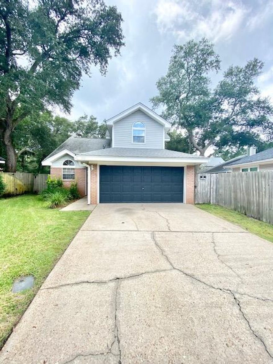 Avail: 5/1. Security deposit = $1995. Yard service included in the rent! 1 SMALL DOG ALLOWED UPON OWNERS APPROVAL & W/ A NON-REFUNDABLE PET FEE. Nice home in Shalimar on a dead end street! Neutral interior paint throughout! Carpet on the stairs & upstairs bedrooms. LVT wood looking flooring throughout the rest. Living room has a fireplace (decorative only), cathedral ceilings & recessed lighting. Kitchen w/ a breakfast bar & all appliances in place. Open living/dining/kitchen combo. Inside utility room w/ washer & dryer included (bonus item/not warranted). 1/2 bathroom downstairs for guests. Split bedroom plan for privacy w/ the master suite downstairs. All bedrooms have ceiling fans & walk-in closets! Home also features an oversized 2 car garage w/ auto opener, open back patio & privacy fenced backyard w/ a lawn pump & sprinkler system on a timer. Only 2 vehicles allowed due to limited parking. SORRY, NO SMOKING OR VAPING ALLOWED INSIDE OR OUTSIDE/ANYWHERE ON PROPERTY BY TENANTS OR GUESTS PLUS TENANTS NEED TO VIEW THE PROPERTY IN PERSON BEFORE APPLYING.