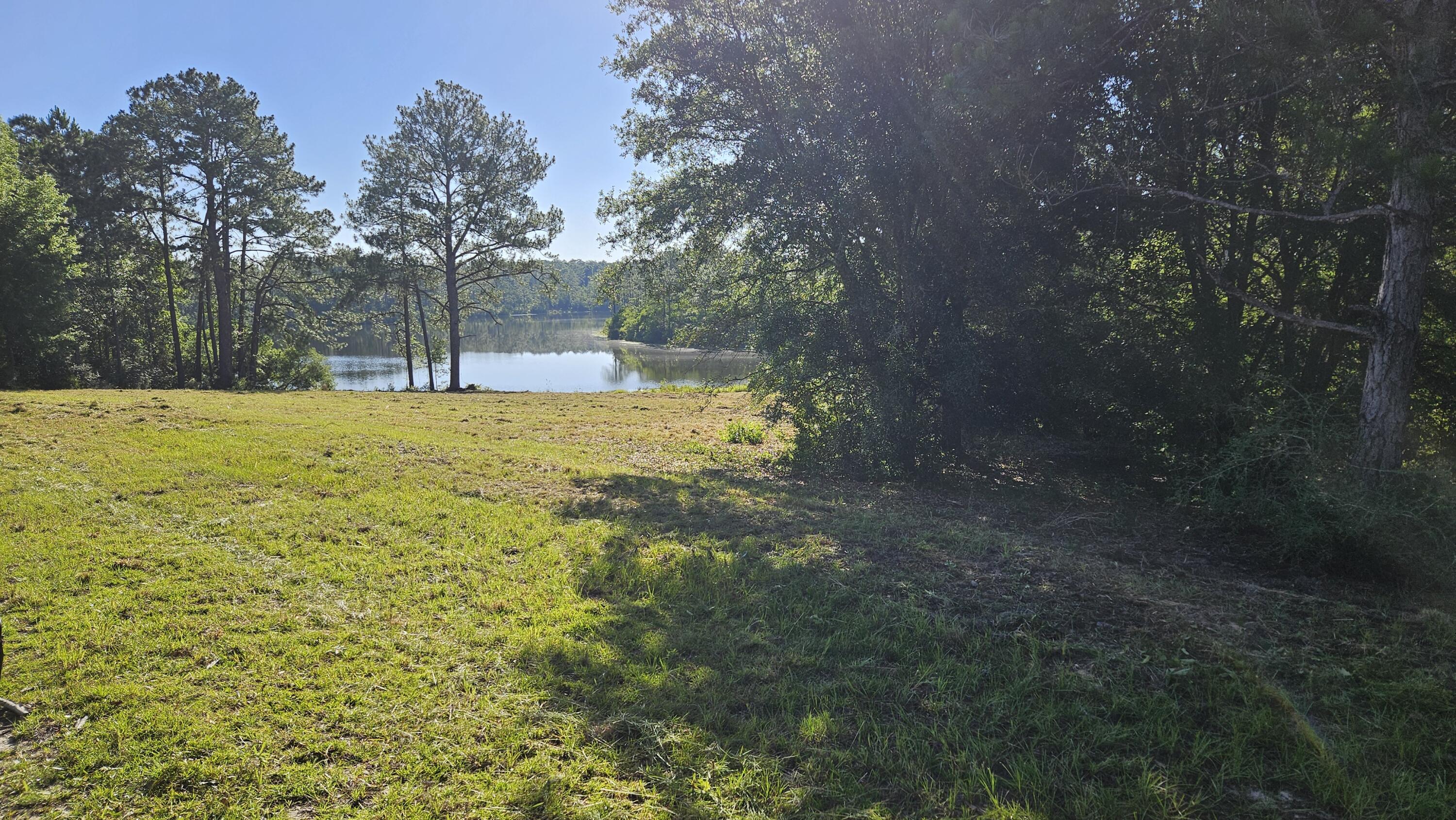 This is a beautiful 24.66-acre home site where you could build your dream home, or even several homes if you want your family close by. Imagine sitting on your back porch facing the serene pond, gazing out at your thriving garden. Enjoy peaceful afternoons fishing, riding dirt bikes, or simply relaxing in the tranquility of your own private space. This property offers the perfect balance of seclusion and possibility, making it an ideal place to create lasting memories and a legacy for generations to come.