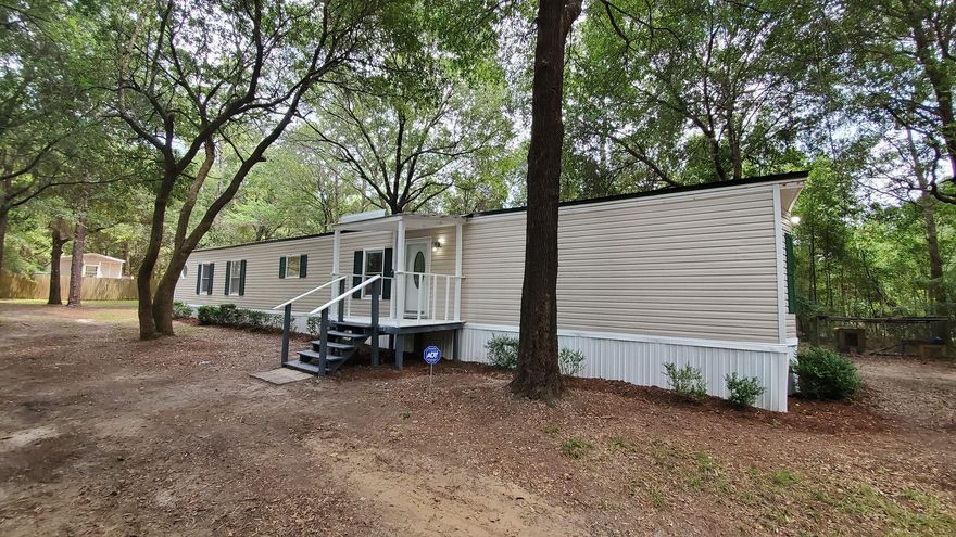 Completely renovated from top to bottom! Split floor plan, spacious living spaces, laundry room and plenty of storage space. New flooring, stainless steel appliances, cabinets, vanities, guest tiled shower and brand new HVAC. This home sits on .44 acres and has beautiful mature trees providing privacy to your yard, 2 storage buildings and even a chicken coup! The separate RV with new covered deck and power will convey with the sale of the home at no additional cost to the buyer (Seller will sign the title off to buyer). All measurements are approximate, buyer to verify if important.