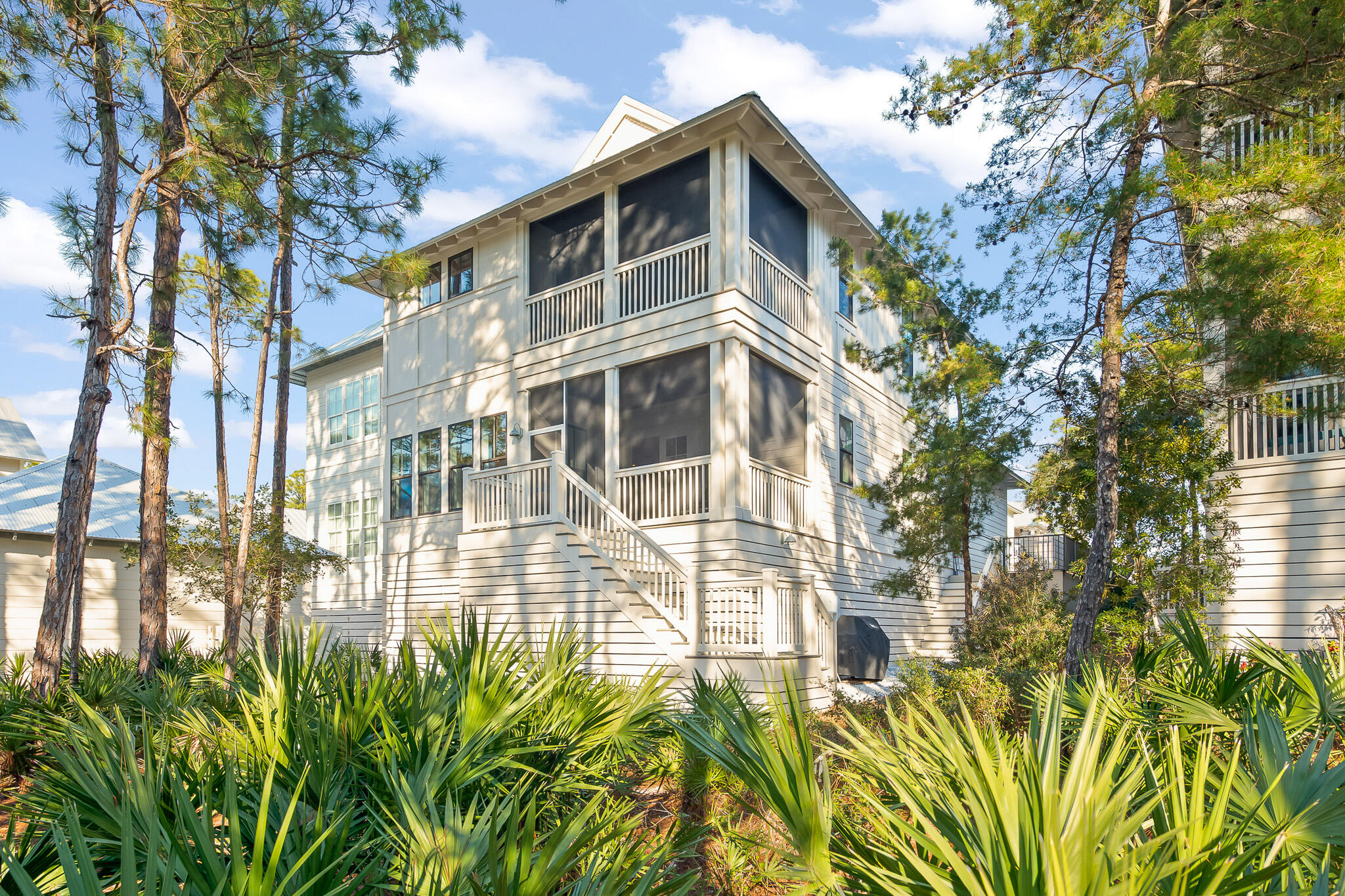 In the gated neighborhood of Lakeside At Blue Mountain Beach, you'll find this stylish, stunning custom built home, which has never been rented, is well maintained & boasts spectacular views of the preservation area around Redfish Lake. Complete with 4 spacious bedrooms plus an office, 3 double vanity bathrooms & a powder room, this home is perfect for families & investors alike. Enjoy details such as large walk-in closets, a master suite on the 1st & 2nd floor, custom trim work & specialty walnut wood floors throughout. Within the home, you'll find a bright, open kitchen with an island perfect for entertaining. Relax on the enlarged front porch or one of two rear screened porches, take a swim in the neighborhood pool or stroll down a half mile to the Gulf of Mexico. Designed by