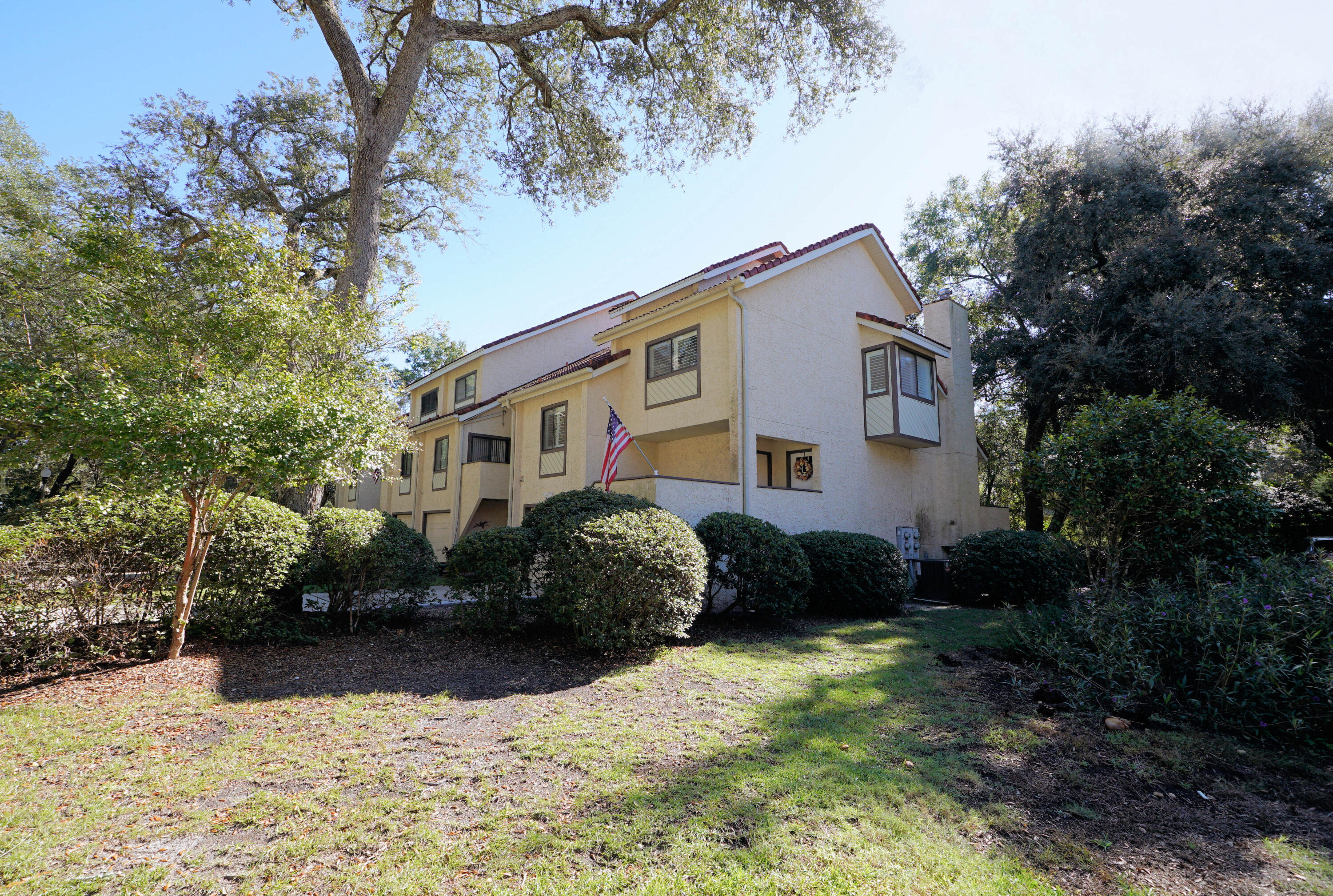 COASTAL LIVING AT IT'S FINEST: Welcome to this charming 2-bedroom, 2.5-bathroom townhome nestled in the sought after Bluewater Bay Marina community. Experience a relaxed coastal lifestyle with modern comforts and endless recreational opportunities right at your doorstep!*Spacious layout: with several areas to relax. Once you have parked in your garage you can walk up a few stairs to your first floor. There you can relax by the fireplace or sit on your 14 x6 foot rear deck and enjoy the quiet wooded common area. The second level has an updated kitchen and dining area complete with granite countertops and bright white cabinets and stainless-steel appliances. There is also a screened in porch where you can enjoy the evening breezes. There are two generously sized bedrooms with ample closet space and each have their own private bathroom. On site, there is a community dock perfect for fishing, paddleboarding, or simply enjoying the waterfront views. You can also take advantage of all of Bluewater Bay offers. You will be in close proximity to swimming pools, tennis and pickleball courts and a top-tier golf course and clubhouse with daily activities. There are numerous pathways ideal for walking or riding bikes, and even a golf cart lane on the main road. There is an excellent seafood restaurant on property that hosts live bands, painting events, paddle board racing and has the most incredible sunset views in the area. THis home is more than just a place to live, it is a LIFESTYLE! 