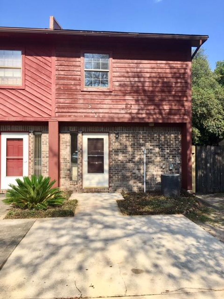 Nice centrally located END UNIT town home. Close & convenient to EVERYTHING- schools, shopping, restaurants & between both bases! NEW INTERIOR & EXTERIOR PAINT & CARPET UPSTAIRS! HUGE PRIVACY FENCED BACKYARD & EXTRA LOT CONVEYS! Relax/entertain on the covered back patio. Storage closet off back patio for your extra stuff. Tiled floors on bottom level & upstairs bathroom. Kitchen has all the appliances in place, breakfast bar, built in desk & an inside utility room. 1/2 bathroom downstairs for guests & 2 bedrooms & 1 full bathroom upstairs. All electric! Master bedroom has a walk in closet & a balcony. 2 extra assigned parking spaces convey with the property on the extra lot for guests. Repair limit = $1,000 TOTAL. Call today before you are too late! This property is priced to sell FAST!