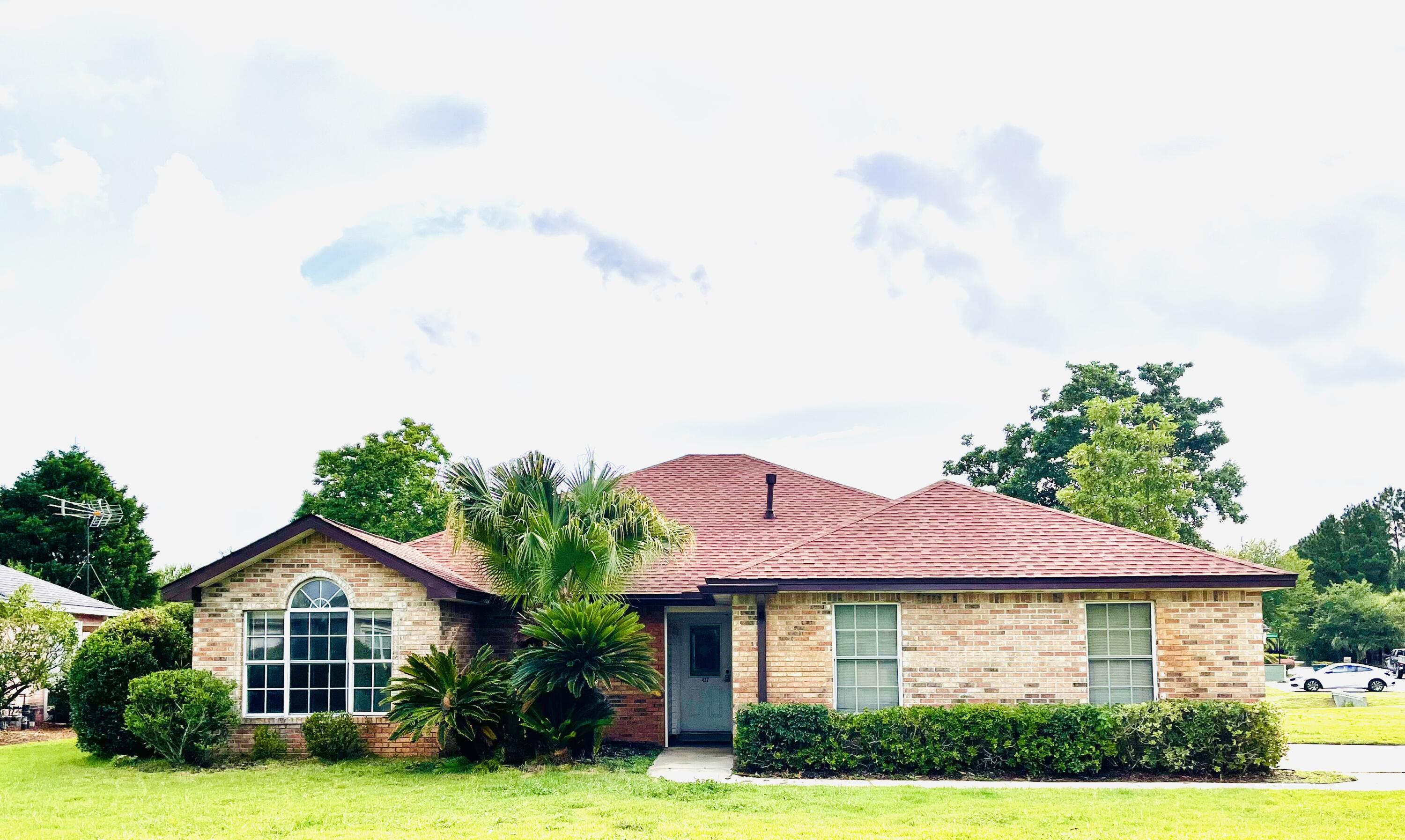 Brick home on an oversized corner lot with view of the Bay and the community dock! Amenities including tennis court, pool and picnic area are just a short distance from this lovely home. Silver Sands Outlet Mall, restaurants, grocery and Beach access are only a few blocks away. This home is priced to sell and is ready for you to put your own customization and renovations to your liking. Roof was replaced in 2024 and carpet in early part of 2025. Come see this home before its gone!