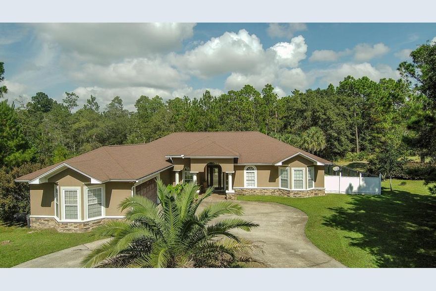 Situated perfectly on a quite cul de sac, perfect for children and pets, this 4 bedroom 3 bath home which includes a full size office was built to impress and entertain. Boasting an open split floor plan with stained stamped concrete floors, granite counter tops, custom cabinetry, private in-ground concrete pool, fenced in back yard and large glass mitered windows, this home was built to impress. Enjoy grilling out on the large partially covered back deck that's flows gently into the gated pool area. Don't forget the spacious kitchen which includes upgraded stainless appliances, large granite counter top and floor to ceiling cabinets. Split floor plan includes a jack and Jill bathroom, large Pool cleaning and maintance included