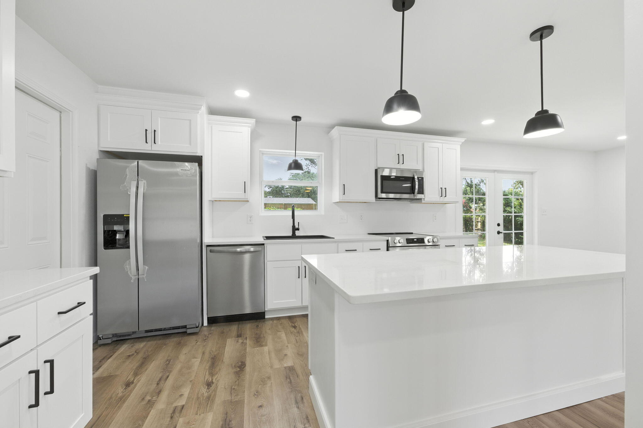 Welcome to 161 Homewood Drive -- a fully renovated, move-in-ready 5-bedroom, 3-bathroom home offering 1,976 square feet of beautifully updated living space. Ideally situated on a spacious corner lot in the heart of Fort Walton Beach, this split-level brick home combines timeless charm with modern style.Step inside to discover luxury vinyl plank (LVP) flooring throughout, sleek recessed lighting, and a stunning open-concept kitchen featuring quartz countertops, white soft-close cabinets, and a full suite of stainless steel appliances. The thoughtful split-level layout offers flexibility and privacy, with multiple living spaces perfect for families or entertaining guests.The primary suite includes a beautifully updated bathroom with custom tile work, while the additional bedrooms provide ample room for family, guests, or home office needs. All bathrooms have been fully renovated with quality finishes.
Additional highlights include a 2-car garage, fully fenced backyard, extra parking pad, and mature landscaping. Located just minutes from Hurlburt Field and Eglin Air Force Base, as well as local parks, shopping, and top-rated schools, this home checks every box.
Don't miss your opportunity to own a like-new home in the established neighborhood of Northgate Estates, schedule your showing today!