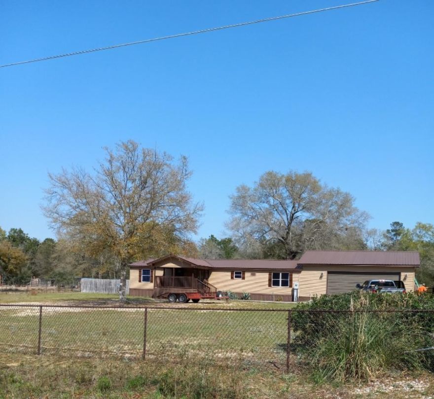 3/2 upgraded manufactured home on 1.6 acres. Large porch and carport added!! Kitchen updated, marble counters, bedrooms flooring and fresh paint. Bathrooms have new tubs and fixturesNo major repairs needed but sold as-is. Many upgrades including a metal roof installed in 2016, fireplace, 24x30 carport can hold an RV, 25x16 ft deck in the back, privacy fenceSchedule a showing today!! Motivated seller!!