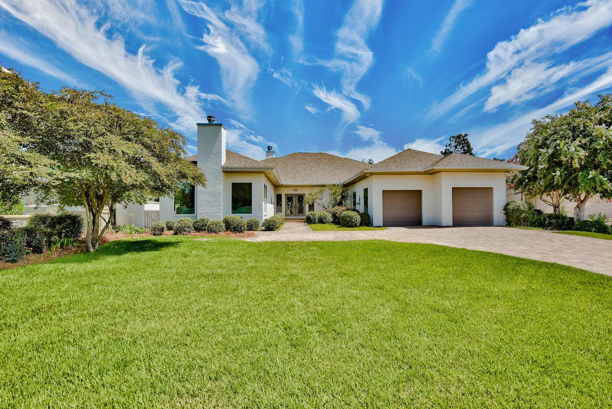 Behind the gates of Bay Point sits an absolutely stunning, RENOVATED, 4 bed/4 1/2 bath home that could be yours! 1st floor features 3 bedrooms and 3.5 bathrooms along with the kitchen, multiple living and dining spaces to fit your needs; as well as an enormous bed and bath on the 2nd floor that could easily be a game room. Each bedroom boasts its own updated bath and both master bedrooms have fabulous walk in closets. 2019 and 2020 updates include a new roof, new flooring, fresh paint inside and out, updated all can lights to LED, all new gutters, new trim in the majority of the home, 1st floor all new impact rated windows and doors, new garage doors, new granite in master bath, new wood blinds and many more! Cozy up to one of two gas fireplaces with new gas logs.