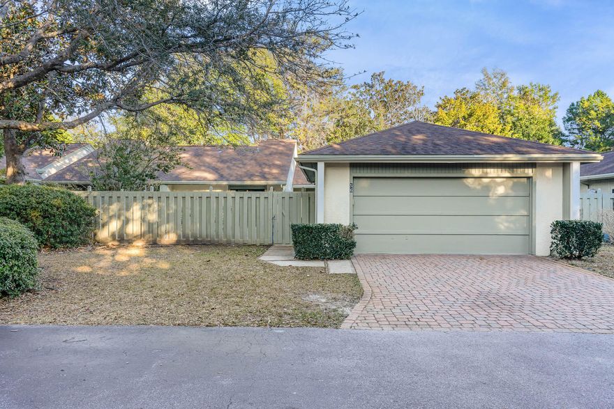 Charming 2 bed, 2 bath patio home in the heart of Bluewater Bay. You are welcomed by a very appealing stone paver driveway. Enter through a spacious private courtyard (perfect for entertaining.) This property has features unlike any other similar units. Welcoming foyer with an abundance of light, vaulted ceilings, 2 sizable living areas, large kitchen, dining room, office. Both bedrooms have large walk-in closets, with a private patio off the primary suite.The oversized 2 car garage with workspace, cabinetry, shelving and storage closets. Garage recently upgraded with additional lighting and ceiling fan. The Bluewater Bay community offers access to tennis courts, walking paths, community pool, short distance to  LJ Schooners restaurant and oyster bar inside/outside dining, live music and gorgeous sunsets and much more.