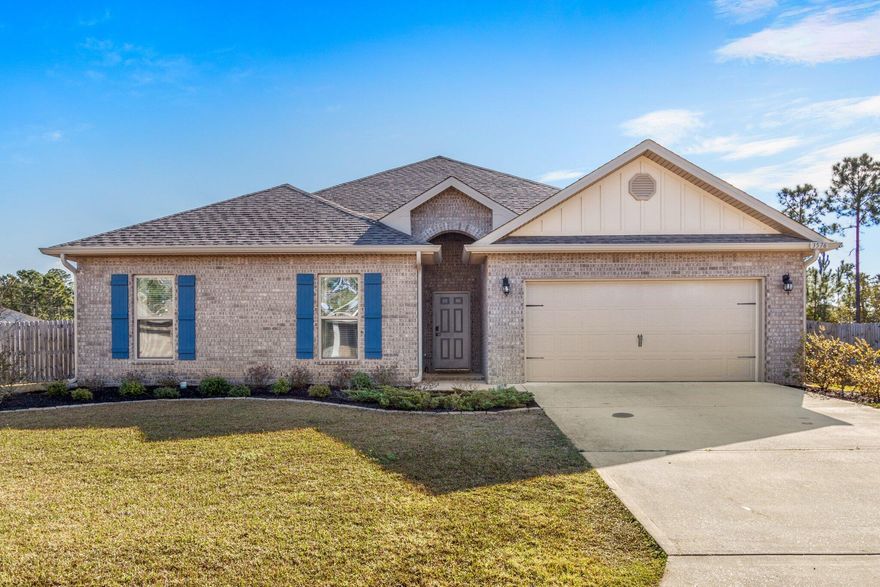 Take a tour of this beautiful 4 bedroom, 2 1/2 bathroom POOL home located in Navarre, FL. This amazing property is in the desirable Treasure Isle subdivision, just off of Hwy 87, minutes to the interstate or the water, and also has underground utilities (no septic). Step inside to be immediately greeted with high ceilings, light color palette, and spectacular luxury vinyl plank flooring. As you walk through the foyer you will notice the conveniently located half bathroom near the spacious living room with double trey, crown molding ceilings, a wood burning fireplace plus large windows to let in the Florida sun.  This home has an open kitchen to living room floor plan that makes it easy to entertain while cooking. The kitchen has beautiful granite countertops, an island with additional storage, all stainless steel appliances, coffee bar, walk-in pantry, and a breakfast area with more of those large windows that look out onto your backyard. Speaking of the backyard, walk through the patio door and there it is.... your own private paradise with large backyard. There is a large covered patio and your very own Gunite Ozone pool.  Add an additional yard building at the end of the totally fenced property, and what else do you need? Master bedroom with an incredible private bathroom that has a large soaker tub, walk-in tiled shower, walk-in closet, and double vanities? Did we mention that the master bedroom/bathroom is located within it's own wing of the home? The beautiful and spacious additional bedrooms plus full bathroom are located on the other corner of the house for all the privacy.   Home has gutters and irrigation was added to the front yard with well.   