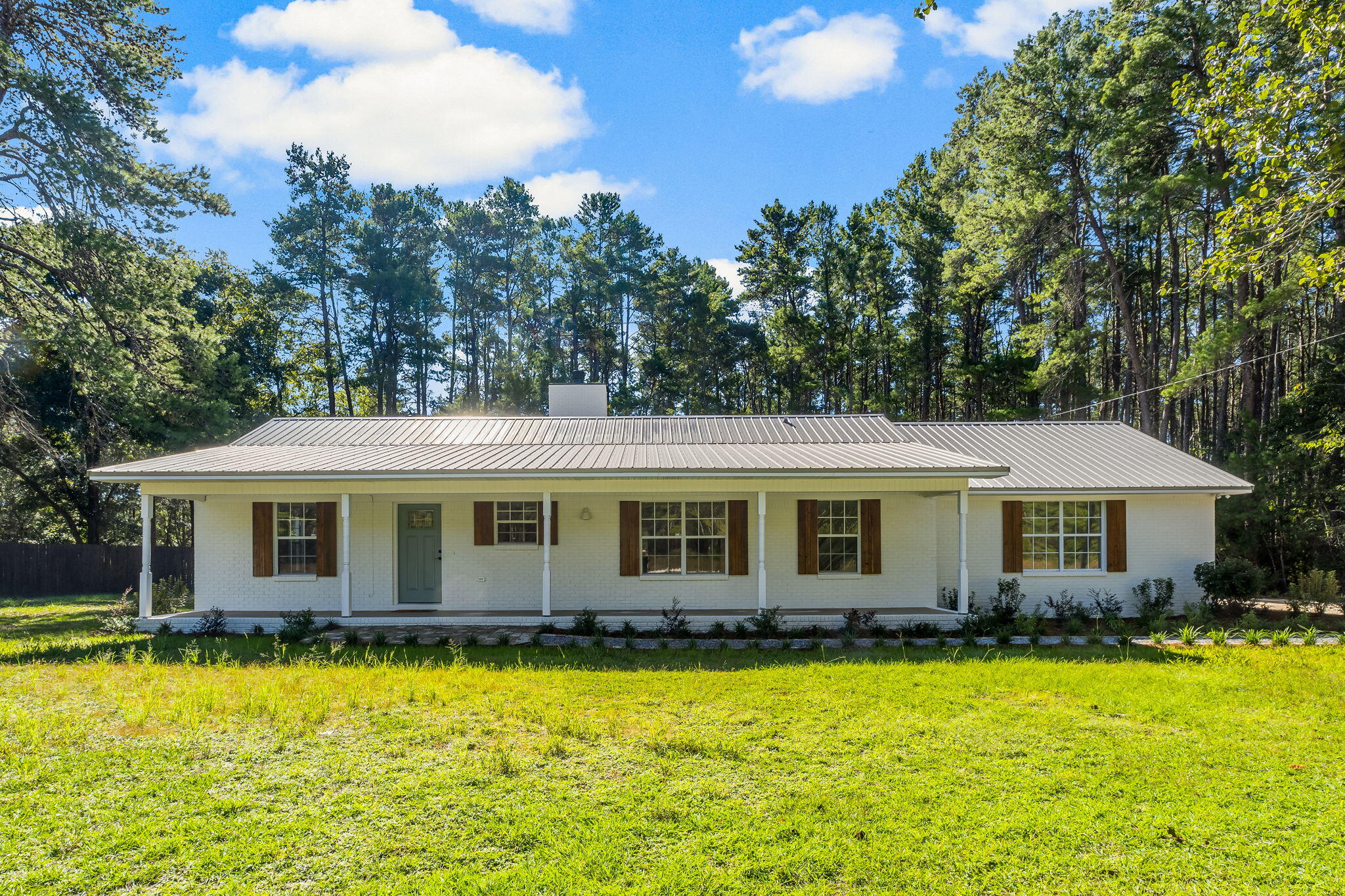 This fully remodeled ranch offers the perfect blend of modern living and rustic charm. Featuring luxury vinyl plank (LVP) flooring throughout, this home boasts three spacious bedrooms and three updated bathrooms. Enjoy cooking with all-new appliances in the fresh, contemporary kitchen. Kitchen opens up to cozy living room with wood-burning fireplace.The property sits on a private, wooded lot with a partially fenced yard, ideal for outdoor gatherings.The yard is also a perfect area for additional parking for guests, extra vehicles, equipment, work trucks and vans, etc. Spacious front porch for sitting and catching sunset hues. No HOA restrictions, giving you the freedom to enjoy your home as you wish!Located on HWY 3280 which is just 2 lights north of the 331 bridge. Easy drive to the beaches and happenings of South Walton and also the shopping centers and restaurants of Freeport.


The Beach Sunsets Inc. Resident Benefits Package is designed to provide convenience and professional services to our residents. By applying, Resident(s) agree to be auto-enrolled in the program and pay an additional $25.00 each month, payable with rent. Benefits of this package may vary due to the property specifications. No discount will be given if an element of the package is not available. The cost of this package is all-inclusive.