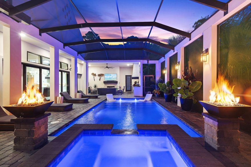 This remarkable Burnt Pine residence offers an unparalleled lifestyle of space, luxury, and comfort. Designed for both entertaining and everyday living, the home is distinguished as the only property in the community with a five-car garage, complete with air conditioning and custom flooring -- ideal for a car enthusiast or collector.From the moment you step inside, your eyes are drawn directly to the sparkling pool and sundeck framed by sliding glass doors, creating an immediate sense of arrival into your own private oasis. The main living area features soaring ceilings, new tile flooring, and a fireplace that anchors the room with warmth and elegance. The gourmet kitchen is equipped with a Wolf stove, Sub-Zero refrigerator, Bosch dishwasher, wine fridge, wet bar, and new quartz island, making it a chef's dream. Every bedroom enjoys the privacy of an ensuite bath, while the primary suite offers a fireplace and a spacious walk-in closet. A newly added mother-in-law suite enhances the home's versatility, making it perfect for extended family or guests.

The outdoor living spaces evoke a resort atmosphere, featuring a pool, brand-new finish, hot tub, sundeck, outdoor kitchen with a fridge, ice maker, gas grill, and fireplace. The expansive fenced backyard also hosts a firepit, ideal for cool evenings under the stars.

Additional upgrades include custom blinds, built-in office shelving, and an in-house generator, ensuring convenience and peace of mind. Blurring the line between indoors and out, this home delivers an atmosphere of relaxed sophistication.

Residents also enjoy access to the exclusive amenities of Sandestin Golf & Beach Resort, creating a lifestyle defined by both privacy and community.