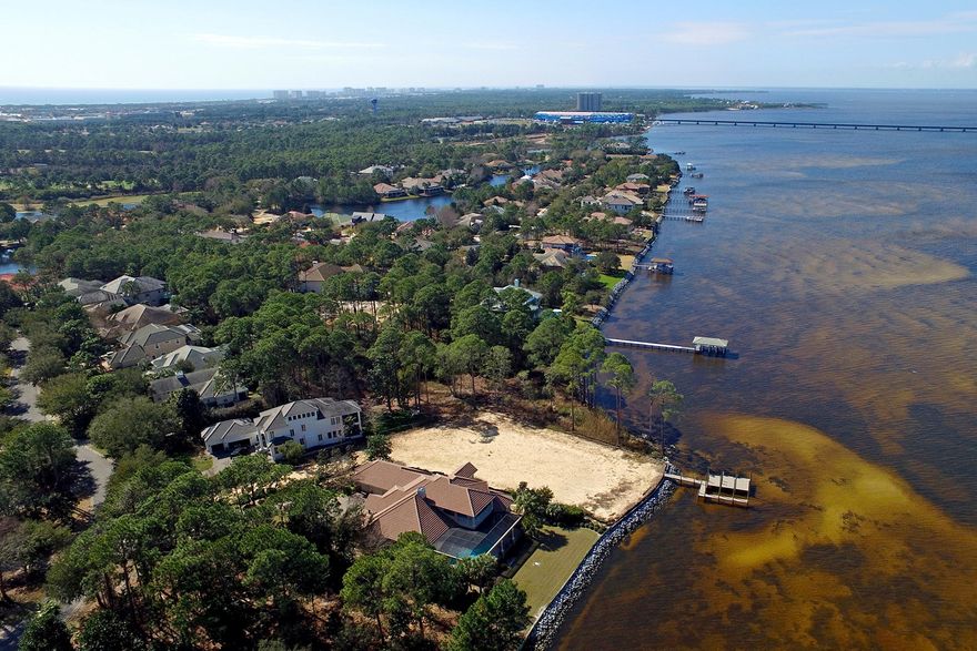 This exclusive Regatta Bay ​front lot offers some of the best views in Destin with over 146 feet of water frontage. This property has a brand new seawall and dock in place which was built to​ the​ highest of standards. The lot has also been cleared and filled so it's ready to be built upon. The layout of the property is ideal with a private drive that opens onto a lot that will boast fantastic views of the ​B​ay from almost any location of the new residence. Regatta Bay consists of 120 acres protected woodlands with over 28 acres of lakes which promote a healthy as well as ​an ​abundant wildlife refuge. This gated community has ample amenities which include one of the best golf courses along the Emerald Coast, community pool, tennis cour