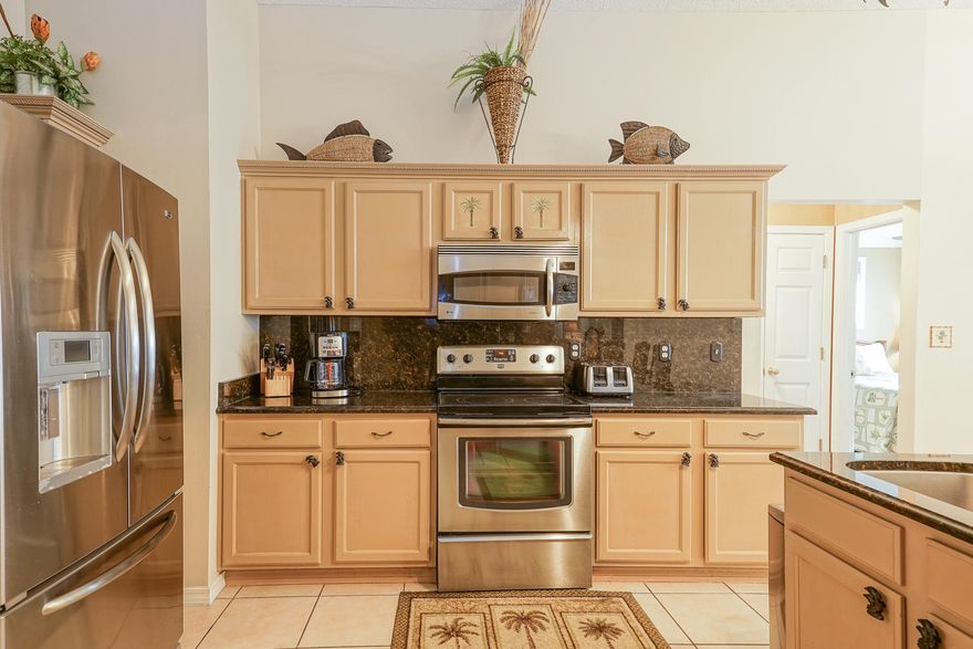 Welcome home! This 3 bedroom, 2 bathroom home sits in the heart of Miramar Beach just minutes from The Outlet Malls of San Destin and the gorgeous beaches of the Emerald Coast. This home is 1780 square feet with an open kitchen to dining concept and a split bedroom floor plan. There is tile in all wet areas (including the kitchen) and brand new manufactured hardwood in the bedrooms. The kitchen is equipped with all stainless steel appliances, a pantry, granite counter tops, a spacious peninsula with bar seating, and plenty of cabinet space for storage needs. Directly off of the kitchen is the Master Bedroom and en suite with a very large walk in closet and custom shelving. The Master Bathroom has dual vanities with a tiled walk in shower and a deep soaking Jacuzzi tub. Across the home