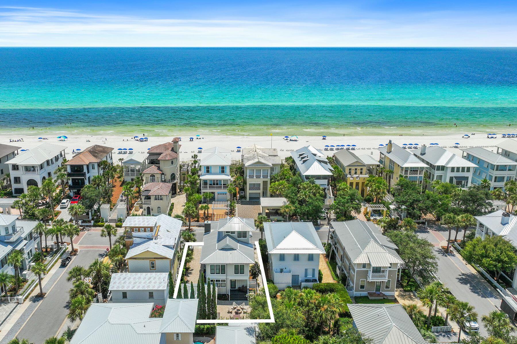 Superbly located just one tier from picture-perfect white sand, this home is a rare find in Carillon Beach. Just across from Walkover #3, you can enjoy nearly a mile of stunning, uncrowded beach and meticulously maintained natural dunes. Never rented, is in pristine condition and enjoys gulf views from multiple levels. Large covered porches on the first and second floors provide the perfect spots to relax and listen to the sound of the waves. This breathtaking retreat offers an unparalleled combination of comfort, luxury and location. Built in 2017, this charming home is highly customized with stacked Poplar crown molding and hardwood floors throughout with wainscot walls and hand-crafted coffered ceilings in the main living areas. Transom windows deliver abundant natural light