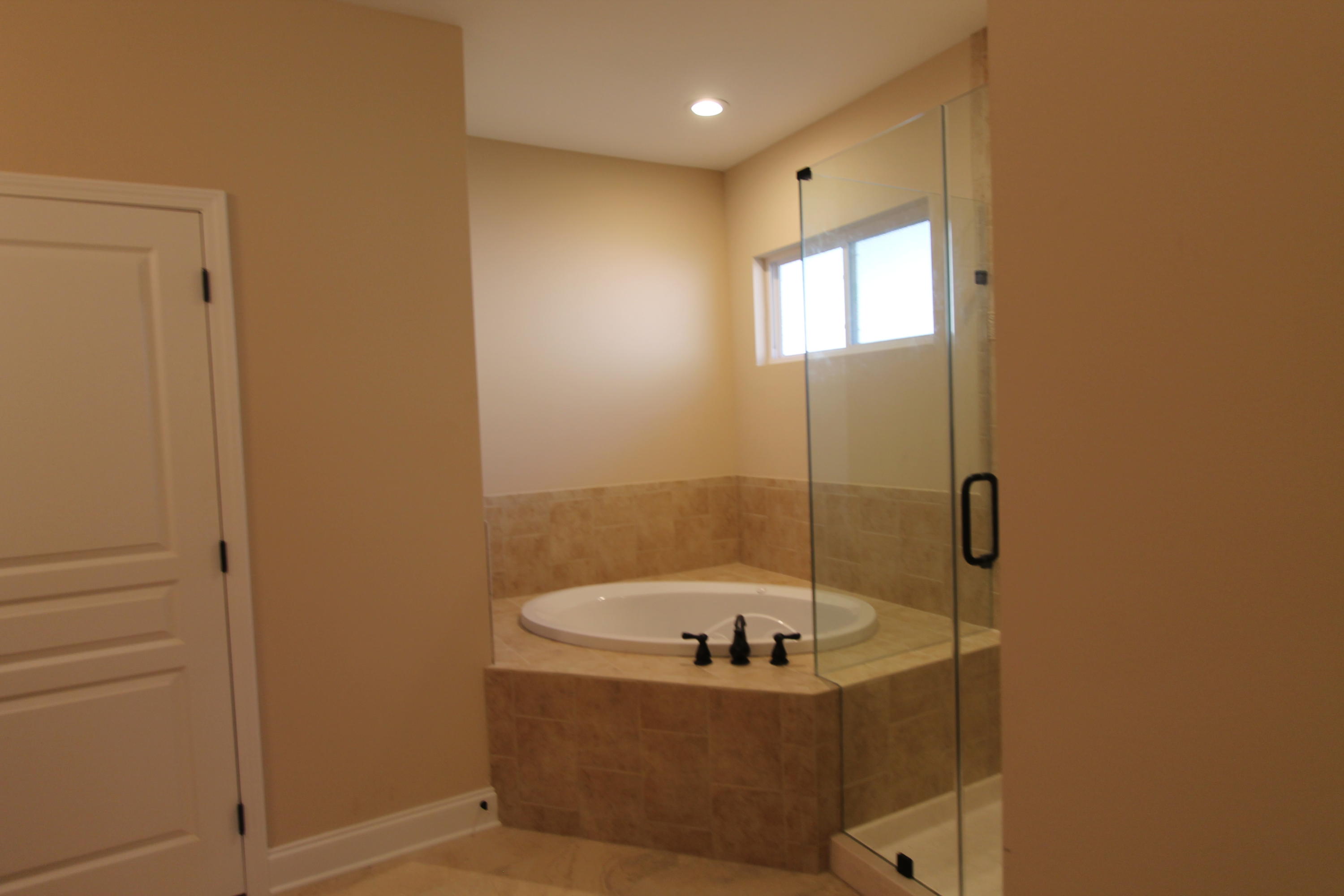 Awesome new floor plan, offered by a multiple award winning builder. Home is on a large lot with beautiful mature trees which is also in a quiet neighborhood with location, location, location. This 4/3 custom brick plan has super curb appeal. There are 10 ft. ceilings w/ impressive crown molding. There is hand scrapped hardwood flooring and and 5 1/4'' baseboard throughout entire home, except for wet areas,(tile). As you enter the home from the covered porch, the formal dining room is on the right of the entry way and bedroom one is just a few feet away on the left (bedrooms 2 and 3 follow on the left of the home as well). The magnificent kitchen has 2 entry's, one from the dining room and one from the greatroom. The chef's delight kitchen boasts a breakfast bar, maple cabinetry, granite countertops, a huge pantry, and stainless appliances (including an oversized commercial grade frig./freezer). The master suite is in the rear of the home, is very roomy, has 2 large walk - in closets, a walk - in shower, a whirlpool garden tub, and a double vanity. The laundry room is conveniently located at the rear of the kitchen. The yard will be beautifully landscaped and comes complete w/ a well, sprinkler system and timer. Insurance will be very reasonable, as home is built to today's code. Home has a Taexx ''in the wall'' pest control system that is serviced from the exterior of the home, for owner's convenience. Completion is expected in August. Listing Broker/Salesperson has equitable interest in the property.