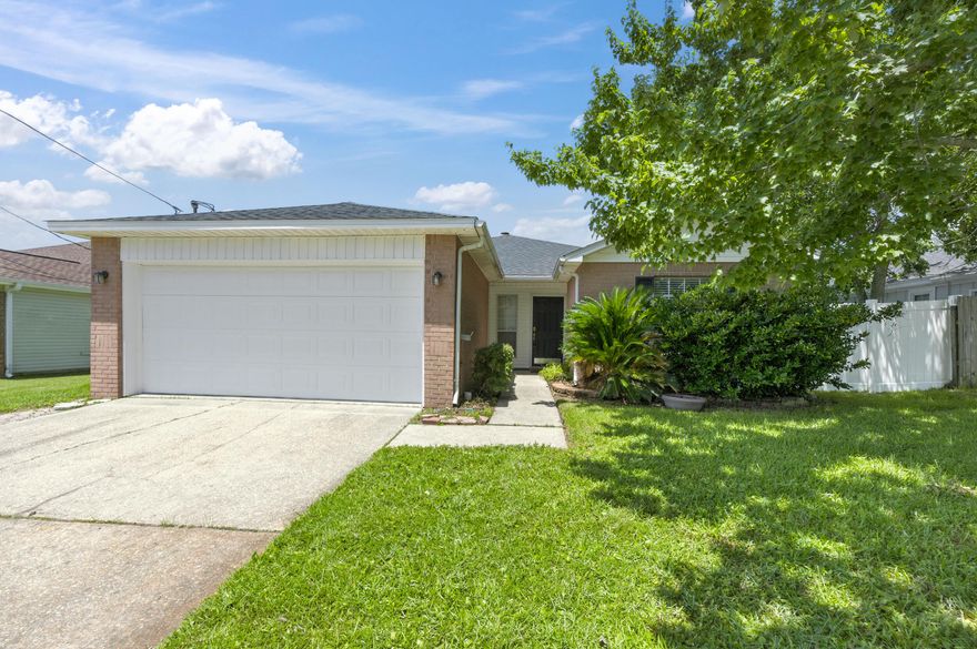 Move-in ready & just 2 miles from Hurlburt Field! This charming 3BR/2BA brick home offers a 2023 roof, spacious living room with vaulted ceiling & cozy fireplace. The kitchen includes ample cabinet space, breakfast bar, and pantry/closet off the dining area. Sliding glass doors lead to covered back porch and fully fenced backyard--great for pets, kids, or entertaining. The generous primary suite features a walk-in closet, double vanity, and relaxing garden tub. Two guest bedrooms share a well-placed hall bath. Laminate flooring in living areas and bedrooms, vinyl in kitchen, baths, and laundry. Large laundry room with shelving for storage. Around the corner to top-rated schools, shopping, restaurants, medical care, and our beautiful white-sand beaches of the emerald coast!