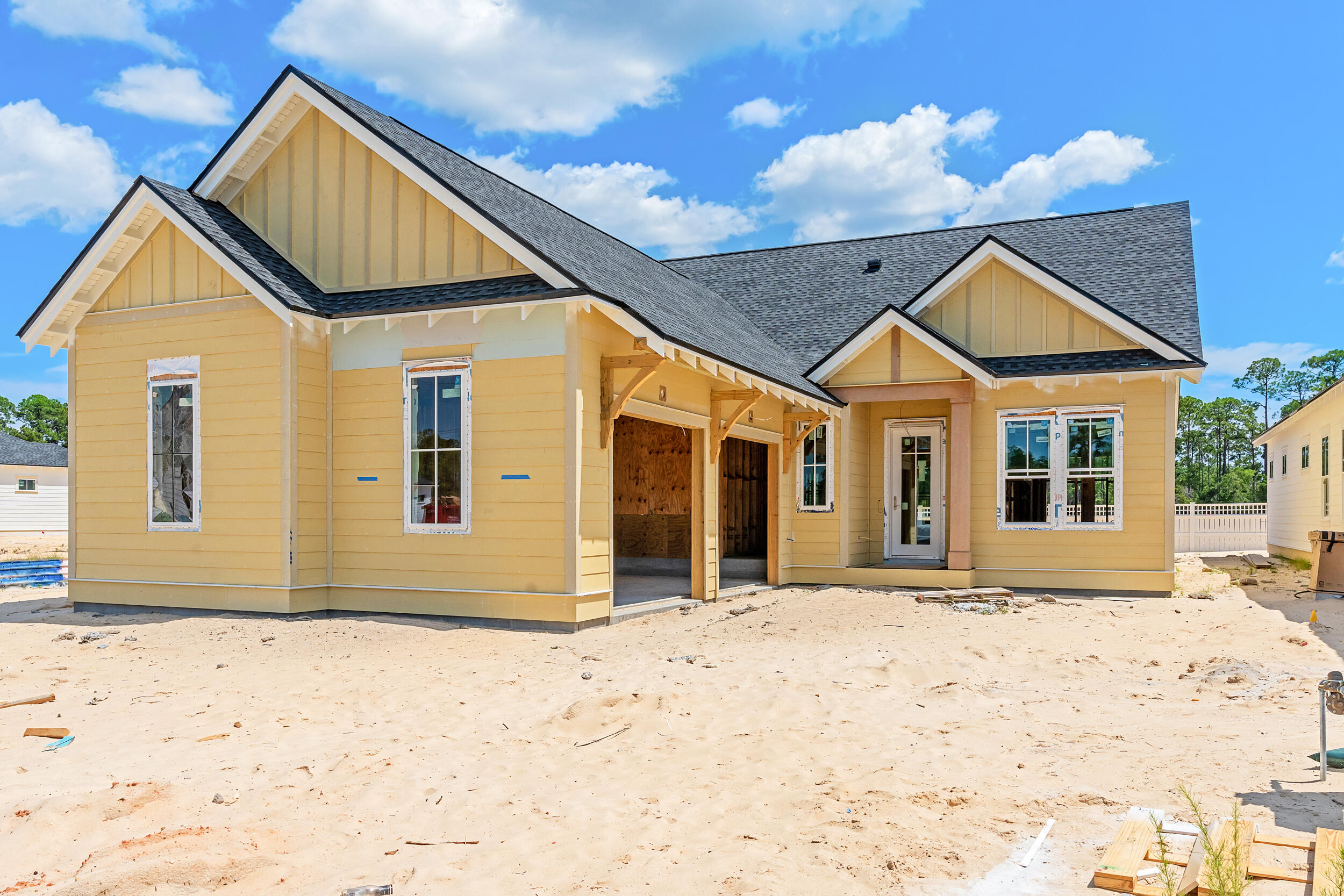 Experience the perfect blend of modern luxury and serene natural surroundings in this new construction home in Powell Landing West in the Watersound Origins community. Anticipated to be complete Oct. '25, the Cyra floor plan on home site PLW 36 by Arkon Group, offers 3 bedrooms, 3.5 bathrooms, a study, and 2,213 square feet of thoughtfully designed living space. Designed for both comfort and style, this home boasts premium engineered wood floors throughout, upgraded tile accents, and an extended kitchen island perfect for entertaining. The chef's kitchen features high-end stainless steel appliances, stacked cabinets to the ceiling with elegant lighting, tile backsplash, and a spacious open layout that seamlessly connects to the living and dining areas. Large slider doors open the living room up to the expansive screened rear porch, where a cozy fireplace creates an inviting outdoor retreat. The primary suite includes a spa-like bathroom and a walk-in closet, while two additional guest bedrooms each have en-suite bathrooms for privacy. A gas lantern on the front porch adds timeless charm, welcoming you home in true Southern style. With 435 sq ft of covered porches, a 2-car garage, and high-end finishes throughout, this home is designed to maximize luxury and livability.
Experience refined coastal living in one of Watersound Origins most sought-after neighborhoods nestled alongside Lake Powell. The Watersound Origins community offers an unparalleled lifestyle in South Walton, exceptional amenities, notoriously friendly and welcoming atmosphere, zero short-term rentals, and close proximity to all that 30A and Inlet Beach has to offer. Enjoy the zero-entry pool, playground, sports courts, and fitness center at the Village Commons, play a round of golf or foot golf at the Origins Golf Course, or take a walk along the many miles of walking and biking trails that wind all throughout the neighborhood!
The new Watersound Town Center located at the entrance to the community offers several fantastic dining options (casual and formal), medical services, Starbucks, Publix, a Pavilion that hosts events year round, and more!