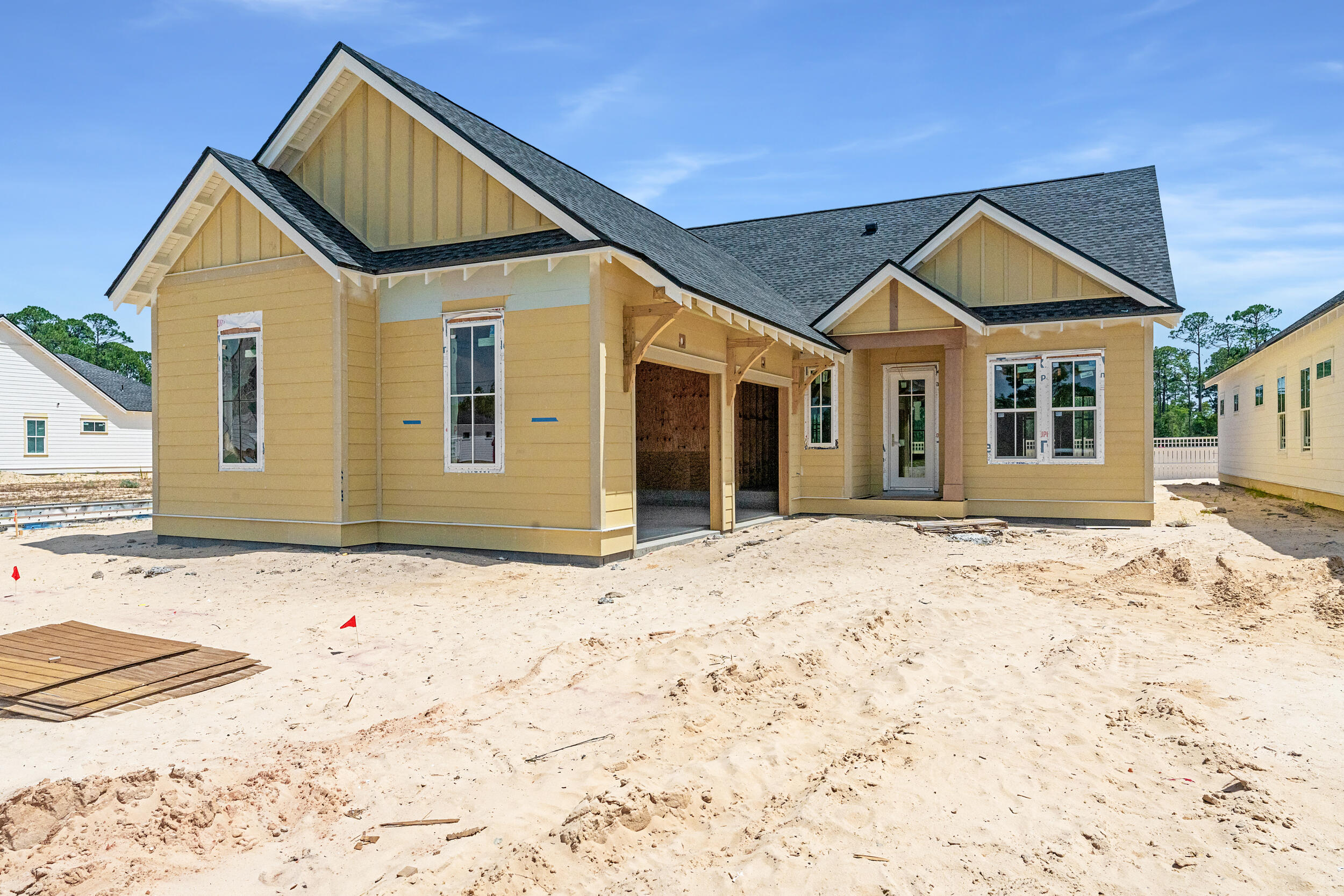 Experience the perfect blend of modern luxury and serene natural surroundings in this new construction home in Powell Landing West in the Watersound Origins community. Anticipated to be complete Oct. '25, the Cyra floor plan on home site PLW 36 by Arkon Group, offers 3 bedrooms, 3.5 bathrooms, a study, and 2,213 square feet of thoughtfully designed living space. Designed for both comfort and style, this home boasts premium engineered wood floors throughout, upgraded tile accents, and an extended kitchen island perfect for entertaining. The chef's kitchen features high-end stainless steel appliances, stacked cabinets to the ceiling with elegant lighting, tile backsplash, and a spacious open layout that seamlessly connects to the living and dining areas. Large slider doors open the living room up to the expansive screened rear porch, where a cozy fireplace creates an inviting outdoor retreat. The primary suite includes a spa-like bathroom and a walk-in closet, while two additional guest bedrooms each have en-suite bathrooms for privacy. A gas lantern on the front porch adds timeless charm, welcoming you home in true Southern style. With 435 sq ft of covered porches, a 2-car garage, and high-end finishes throughout, this home is designed to maximize luxury and livability.
Experience refined coastal living in one of Watersound Origins most sought-after neighborhoods nestled alongside Lake Powell. The Watersound Origins community offers an unparalleled lifestyle in South Walton, exceptional amenities, notoriously friendly and welcoming atmosphere, zero short-term rentals, and close proximity to all that 30A and Inlet Beach has to offer. Enjoy the zero-entry pool, playground, sports courts, and fitness center at the Village Commons, play a round of golf or foot golf at the Origins Golf Course, or take a walk along the many miles of walking and biking trails that wind all throughout the neighborhood!
The new Watersound Town Center located at the entrance to the community offers several fantastic dining options (casual and formal), medical services, Starbucks, Publix, a Pavilion that hosts events year round, and more!