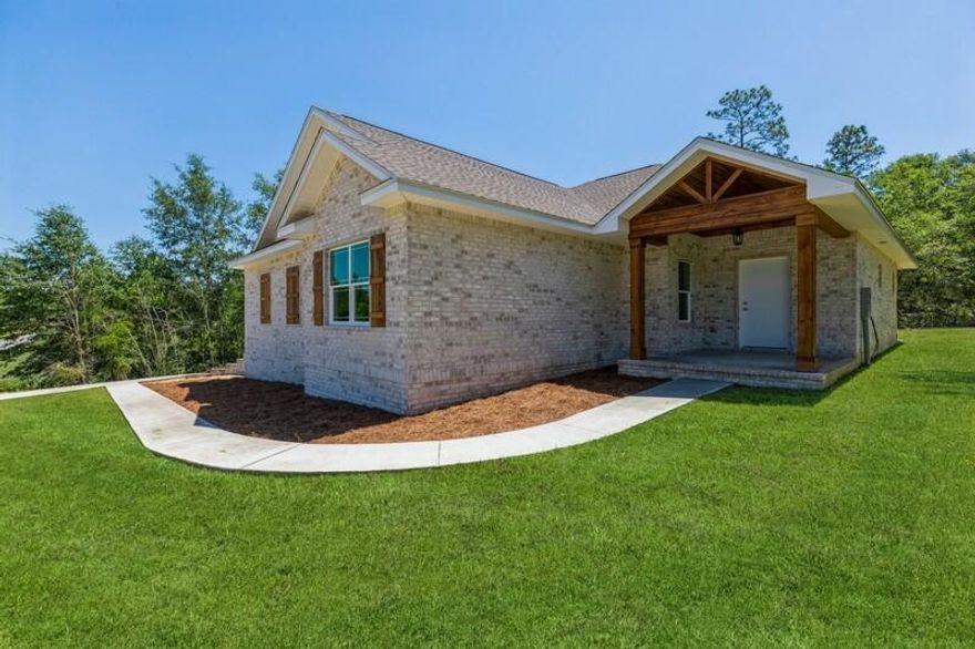 Welcome to this stunning 3 bed, 2 and 1/2 bath, 2,130 sq. ft. custom craftsman style home!The features of this brand new construction home greet you even before you walk in the door! Upon arrival you are greeted by hardwood stained columns of a covered front porch. So much curb appeal, & so many unique details! Split floor plan design with open concept of living, kitchen & dining. Exposed beam ceilings, wood look laminate flooring throughout, Maytag appliance, upgraded light fixtures, tile in the wet areas, huge 599 sq. ft. side entry true 2-car garage, custom secret interior space, & a great use of antique/reclaimed brick.(continued)