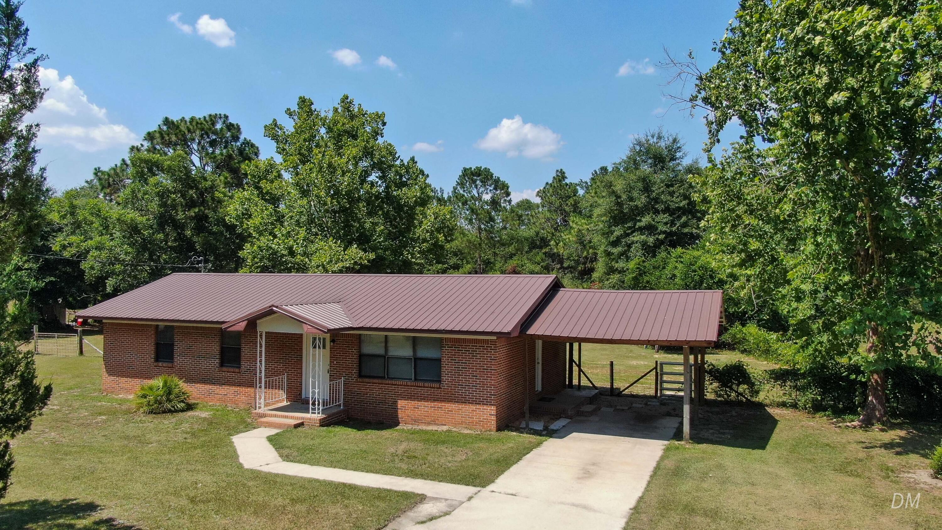 This 3-bed, 2-bath brick beauty on 1+ acre east of DeFuniak Springs is move-in ready--because renovations aren't a hobby, they're a headache.Enjoy updated bathrooms, sleek tile floors, and a stylish kitchen with painted cabinets, modern countertops, and appliances that actually do their job. The metal roof (10 years or less) stands strong, windows (installed in 2022) keep the squirrels guessing, and HVAC (just 1 year old!) keeps things cool without effort. Plus, a water heater (3-4 years old) that won't leave you shivering mid-shower.Out back, there's a huge 30x40 barn with a separate meter (not hooked up yet), waiting for your vision--storage, projects, or a secret escape.10 minutes to downtown, 40 minutes to the beach. Country charm, coastal perks.All financing accepted!