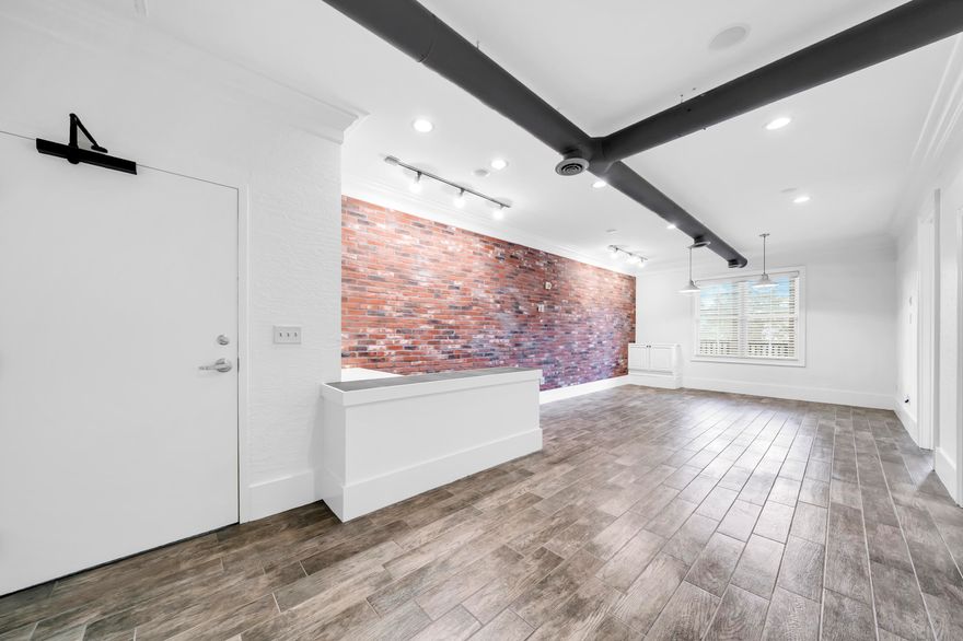 Prime Commercial Office Space for lease on Scenic 30A!  Strategically located in Redfish Village, enter from a heated/cooled hallway into open space with reception counter, brick accent wall, windows and natural light.  This 718 sq ft unit includes 2 private offices, tile/hardwood flooring throughout (no carpet), kitchenette, and one of the only private restrooms in this complex.  Exceptional location with established businesses including on-site restaurant (Redfish Taco), coffee/donuts/ice cream across the street (Blue Mountain Creamery) and close proximity to the beach.  Gross lease, call today for details!