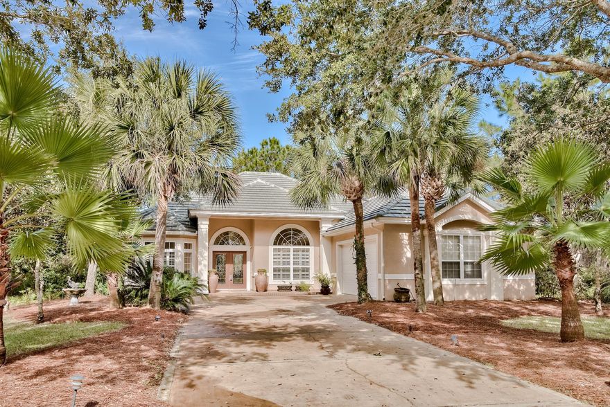 Privacy and natural beauty are the keynotes of this lakefront home sitting on a 0.4 acre lot bordered by a natural preserve. Tile flooring and elegant arches grace the light open-plan living room with its feature fireplace and custom built-in cabinets. The angled granite breakfast bar separates the fully fitted kitchen with wet bar from the neat breakfast area. Delivering lake views from almost every room, the split floor plan includes a luxurious master suite with deep trey ceiling and ensuite bathroom offering therapeutic soaks in the corner whirlpool tub. All this just a stone's throw from Destin Commons shopping and dining, the Golf Digest acclaimed golf course and the sparkling white sands of Miramar Beach.