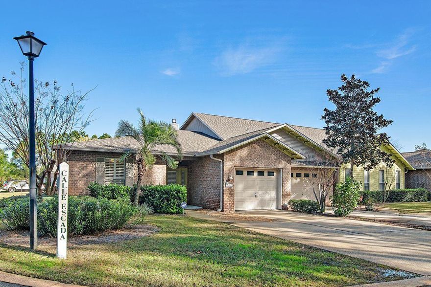 Nestled in the serene Calle Escada community, this end-unit townhome offers a perfect haven for those seeking a peaceful escape or a vibrant coastal lifestyle. Ideal for retirees, first-time buyers, or anyone yearning for a place at the beach, this charming home boasts single-level living with privacy and convenience. Step inside to discover a bright and airy space adorned with plantation shutters, allowing natural light to dance across tile floors in the living area and new engineered hardwood in the guest bedroom and office. Relax on the screened porch, savoring fresh breezes and the melody of birdsong. Three bedrooms and two bathrooms provide ample space for family or guests, and a freshly painted interior ensure a move-in-ready haven.