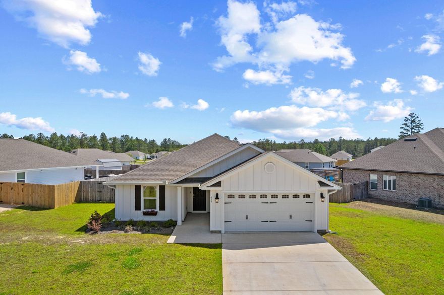 Like-new former model home on a premium elevated lot! This beautifully maintained 3BR/2BA home in Freeport features an open-concept layout, luxury vinyl plank flooring, and a fully fenced backyard. The standout feature is the finished garage, complete with LVP floors, recessed lighting, and its own mini-split HVAC system--ideal for a gym, studio, or climate-controlled flex space. Lightly lived in and loaded with upgrades, this home offers privacy, space, and functionality in one of Freeport's most desirable communities. Just minutes from schools, shopping, and the beaches of South Walton