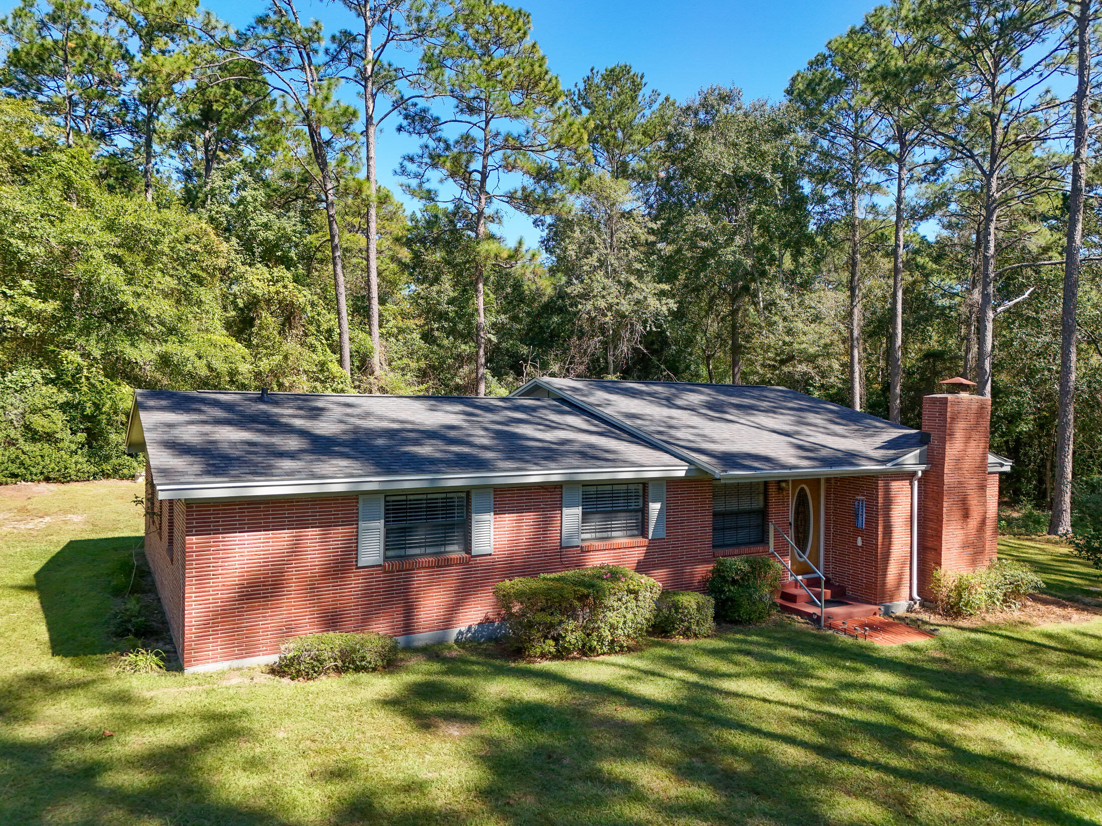 This charming 4-bed/2-full bath brick home offers 1,574 sq. ft. of potential and sits on a generous 1 ac lot comprised of two lots. Lovingly cared for by its original owner, this mid-century gem features a brand new roof. Teelinville is an established neighborhood known for its spacious lots, towering trees, and diverse architectural styles. This property offers a serene setting while being conveniently located just outside the city limits. You'll have quick access to Hwy 331S for an easy 30-minute drive to the pristine beaches of the Emerald Coast. With a little updating, this solid home could truly shine and would make an ideal choice for a first-time buyer, retiree, or savvy investor. Classic home in classic DeFuniak...Inspections completed and can be made available for serious buyers.