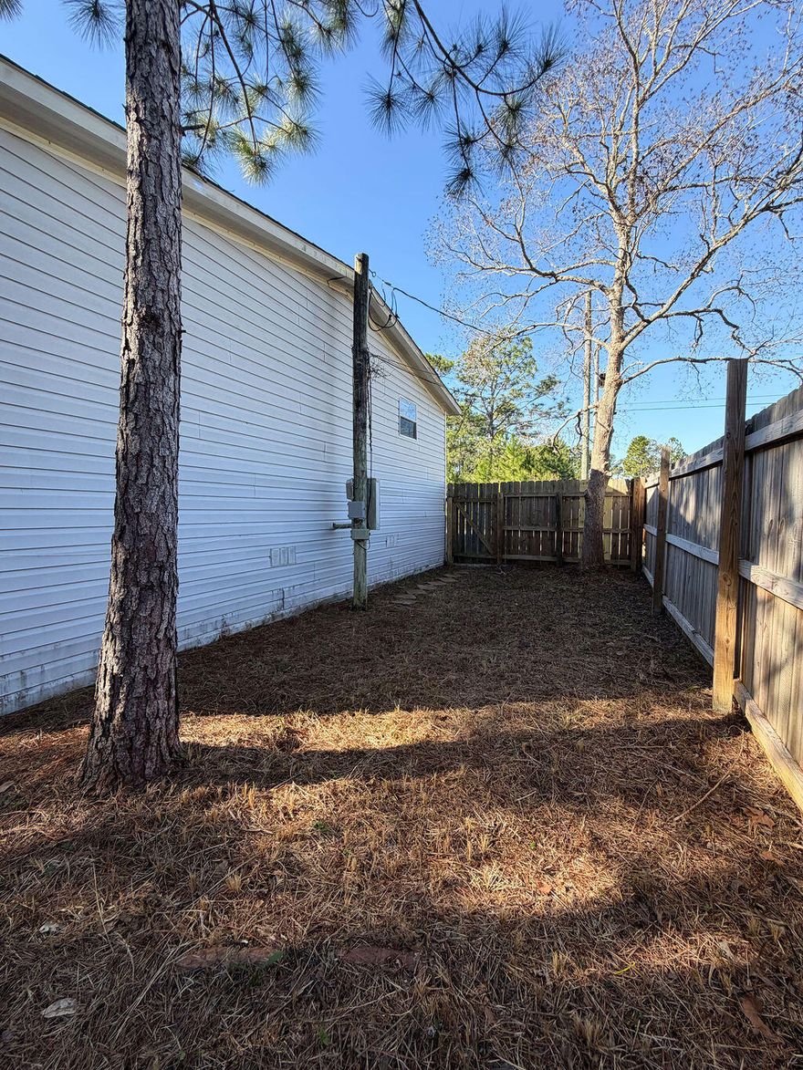 Well taken care of Double Mobile home with privacy in a quiet East Navarre location.  This home has privacy in back and located in a quiet neighborhood which is in close proximity to Publix, Walmart, and Aldi and a short distance to the beaches,  Owner has taken pride and made improvements including hot water heater, roof, flooring, whole house electric, AC,  & paint.  Property comes move in ready with washer & dryer, toaster oven and microwave.  There is so much storage space in the kitchen area and the open concept with fireplace makes it very inviting and roomy.  Seller is willing to assist buyer with closing costs - do not miss your chance to check this one out today.  I think you'll be pleasantly surprised at its beauty!Great proximity to both Eglin and Herbert Air Force Bases!