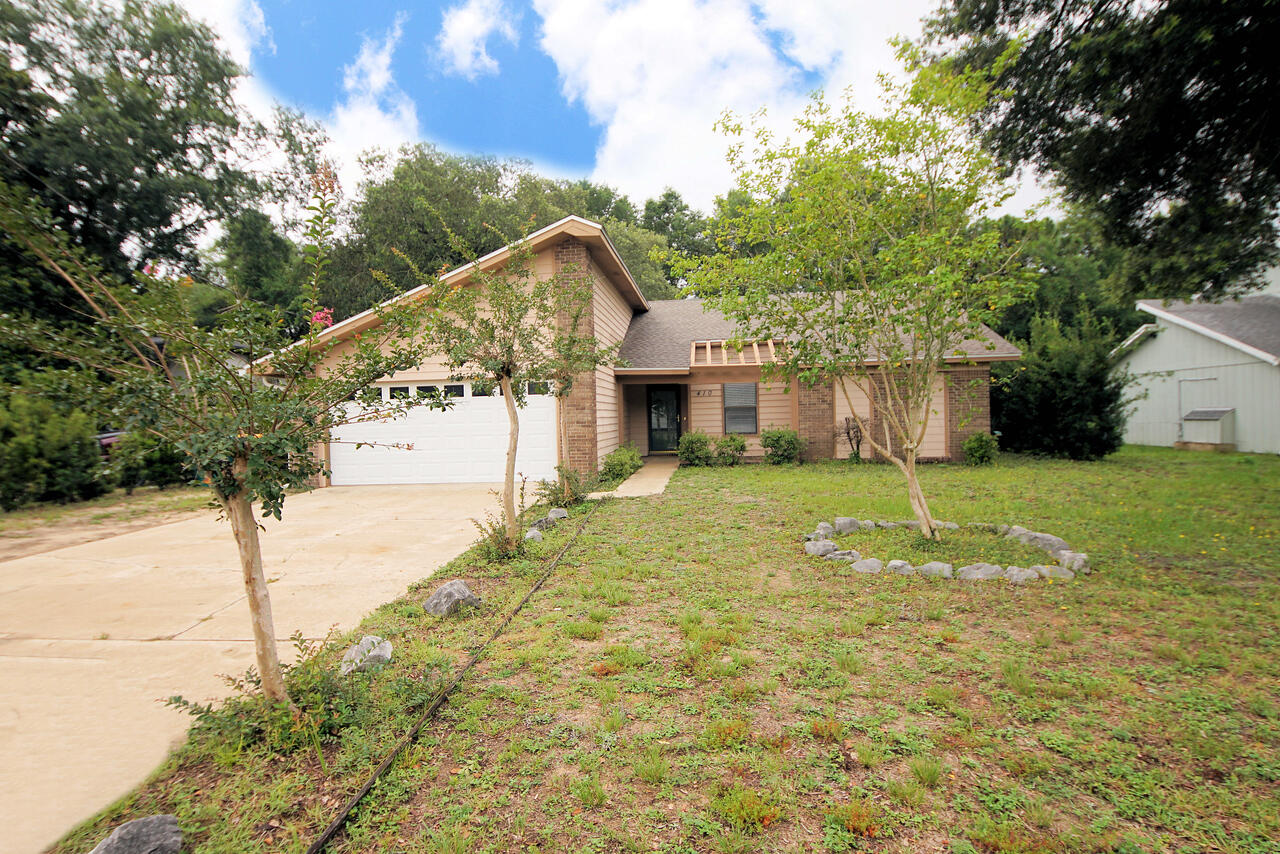Charming one-story home in the heart of Fort Walton Beach! This 3-bedroom 2 bath home has undergone substantial renovations to include: new roof in 2021, quartzite countertop in the kitchen and guest bath, added cabinetry in the kitchen, new stainless-steel dishwasher and stove with air fryer, new water heater, new carpet in 2021, added gutters, and a new fence. There is a large sunroom with two sliding glass doors overlooking the large, fenced backyard with an open deck. Call to arrange your private showing today!