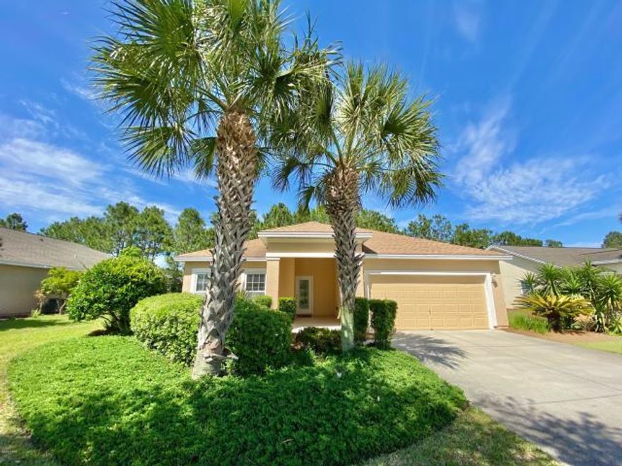 Come see the lowest priced home in all of Palmetto Trace!!!! This 3 bedroom 2 bath home is conveniently located near one of two neighborhood pools, beaches, and pier park. This home offers recently upgraded nickel light fixtures, wood and terazzo flooring, stainless steel appliances, screened back porch and granite counter tops. VACANT AND EASY TO SHOW IN PERSON OR VIRTUAL!