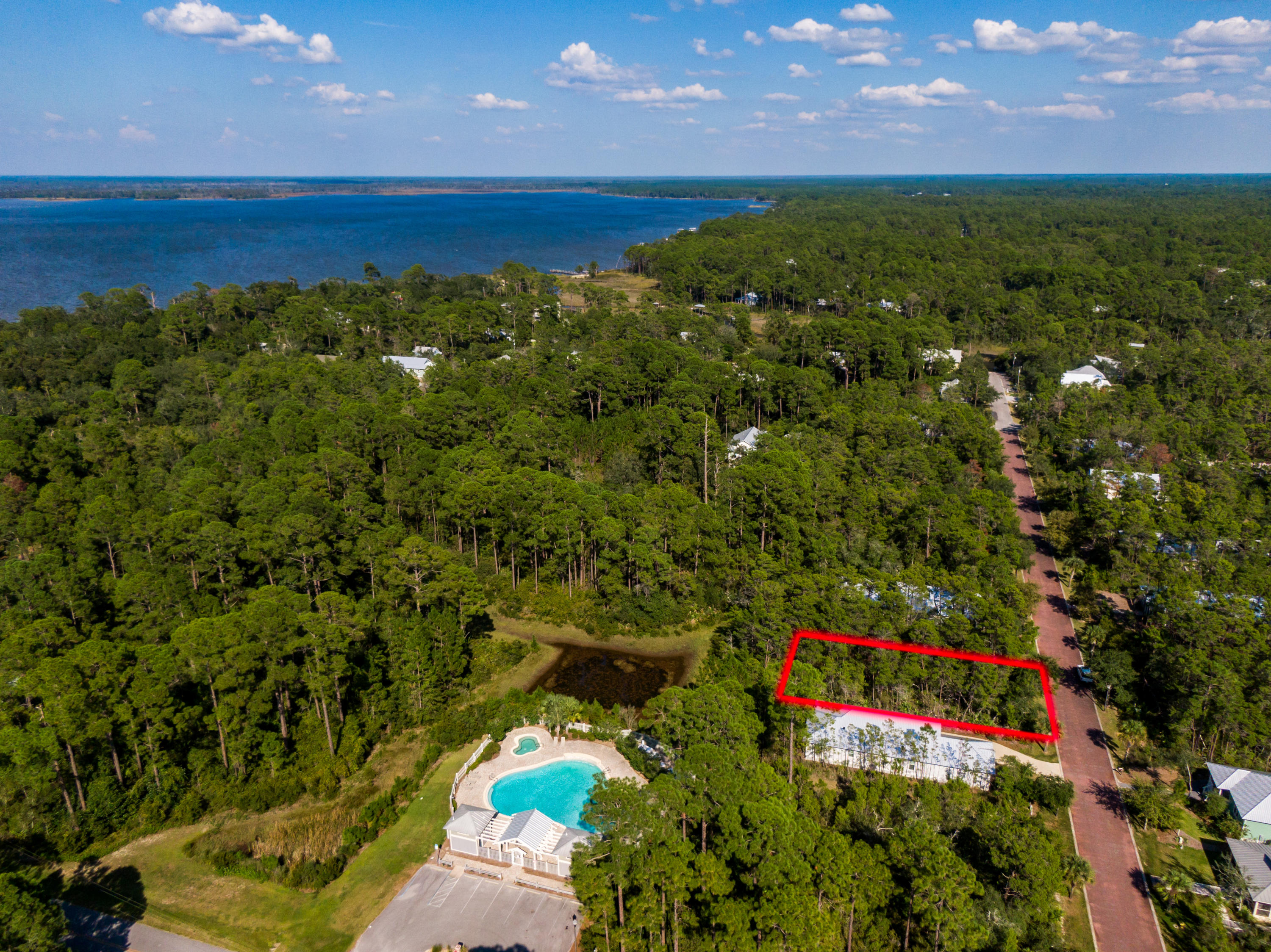 Grayton Bayou is the perfect location to enjoy all that South Walton has to offer! Come build your dream beach cottage in this charming community with bricked paved streets, shaded pathways, underground utilities, community pool and bayou access. There is no build out time, and tap fees are already paid, making this lot highly desirable and giving you ease to build. Point Washington's extra preservation keeps the ''old Florida'' look in this area. Just steps from the community pool, a short walk to the community boat ramp, bayfront park and a five minute drive to the sandy white beaches along 30A.