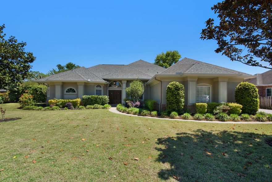 Captivating custom home on Cougar Circle! Welcome to this single-story pool home nestled deep within the gated community of Magnolia Plantation in Bluewater Bay. Built in 2003, this 4 bedroom & 3 FULL bath home has had ALL the major items updated and is ready for you to call it home! The sprawling corner lot features lush landscaping, a large front & side yard, oversized driveway, screened lanai with pool, and a 2 car garage PLUS golf cart garage! The beautiful custom double front door welcomes you to the open floor plan with dining area, large family room with custom built in storage and gas fireplace, flex space for additional living or dining area, and stunning custom kitchen with stainless appliances, abundant storage, corner pantry, hanging pot rack, and ample counter space! --->