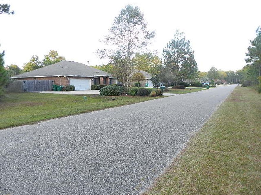 Great Location in Holley by the Sea lifestyle community only 4 blocks from the Hidden Creek Golf Course and 2.0 miles from the Lifestyle Center. .46 Acre lot with public sewer available for new home construction. Wetlands study available after 11/13/2014. Excellent location centrally located in Holley by the Sea convenient to schools, golf, fishing, boating, and all activities. Lot is less than 30 miles from International Airport Pensacola and 35 miles from the Regional Airport in ValP. The medical services and schools are excellent. Within 5 miles of Navarre Beach public beaches on the Gulf, State Park and State Boat Launching, Longest Fishing Pier in the State and the National SeaShore.