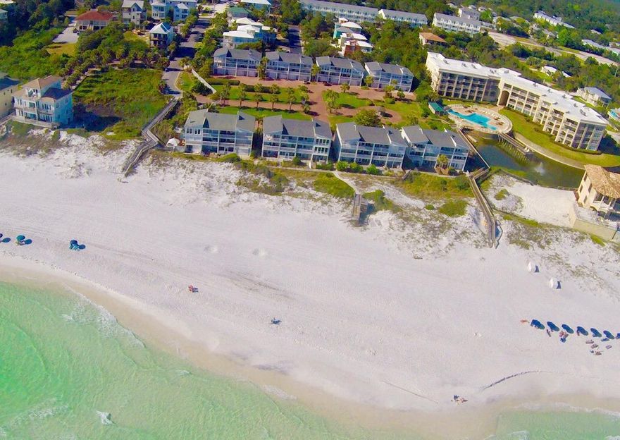 Low HOA fees and $40,000+ annual rental income (with owner use.) The gated community of Sea Haunts Town-Homes is located directly on the beach, on the south side of 30A. Sit on the balcony and enjoy the view of the emerald water & white sand. The communities of Seaside, Watercolor and Grayton are also close by. Walk to Gulf Place and enjoy shopping, dining, and concerts at the amphitheater.