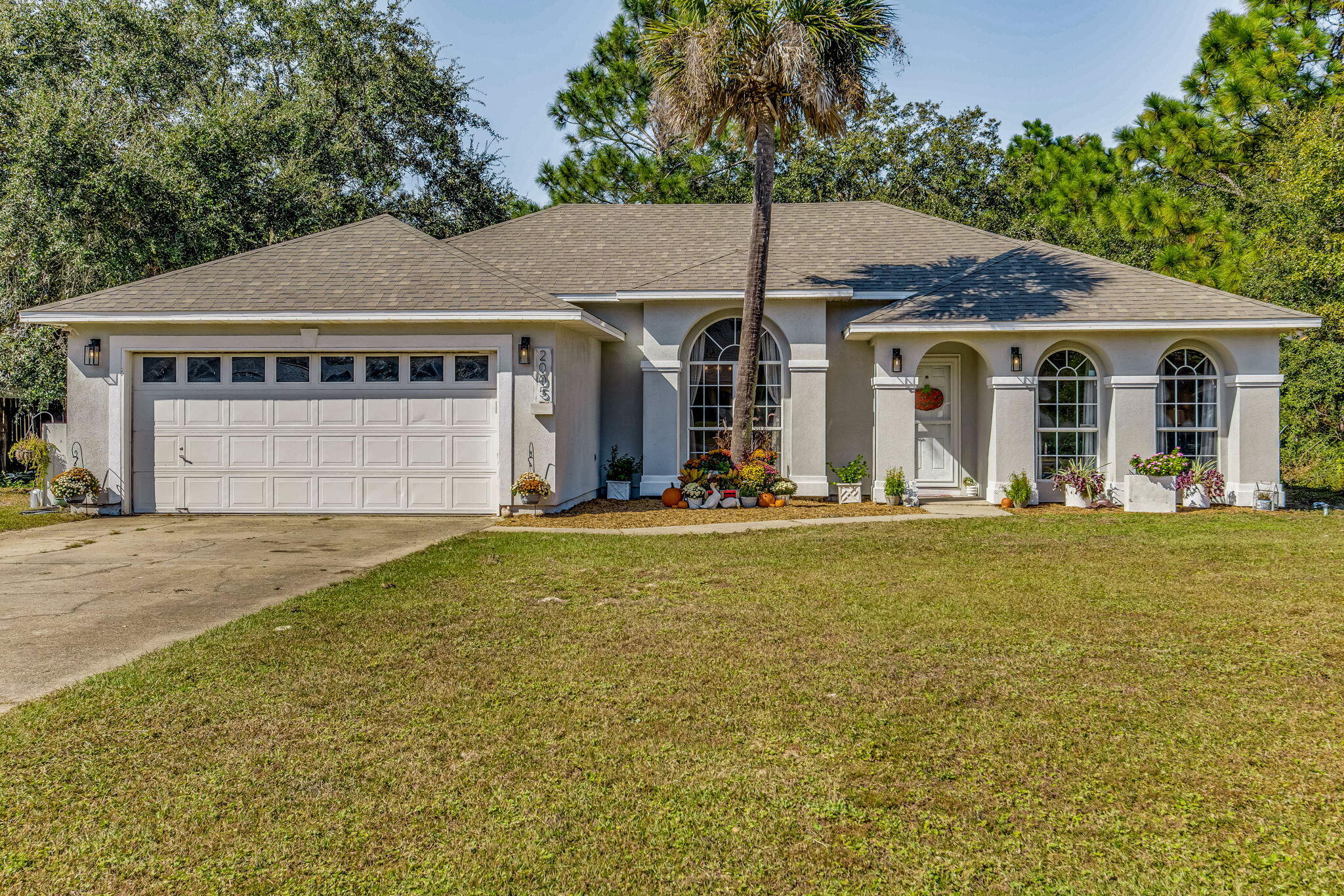 Welcome to this charming 3-bed, 2-bath home with fantastic updates and a prime location! Key features include roof (2020), grinder pump (2019), HVAC (2016), a water heater (2017), stove (2022) and a newer refrigerator (2022). Inside, you'll love the new LVP flooring, fresh paint in neutral tones, and the open, spacious living room perfect for entertaining. Plus, the custom-built catio is an added bonus and may stay with the right offer!Sitting on a generous .46-acre lot, the backyard extends beyond the small fenced area. Located in the highly desirable Holley by the Sea community, which boasts a stunning 48-acre park along Santa Rosa Sound.Enjoy exclusive access to the Rec Center with amenities including 3 pools, a full gym, 8 lighted clay tennis courts, lighted basketball courts, sauna, steam room, and a game room. The community park also offers picnic pavilions, a playground, a fishing pier, and a private beach. For golf enthusiasts, membership at the HBTS golf club is available for a separate fee.