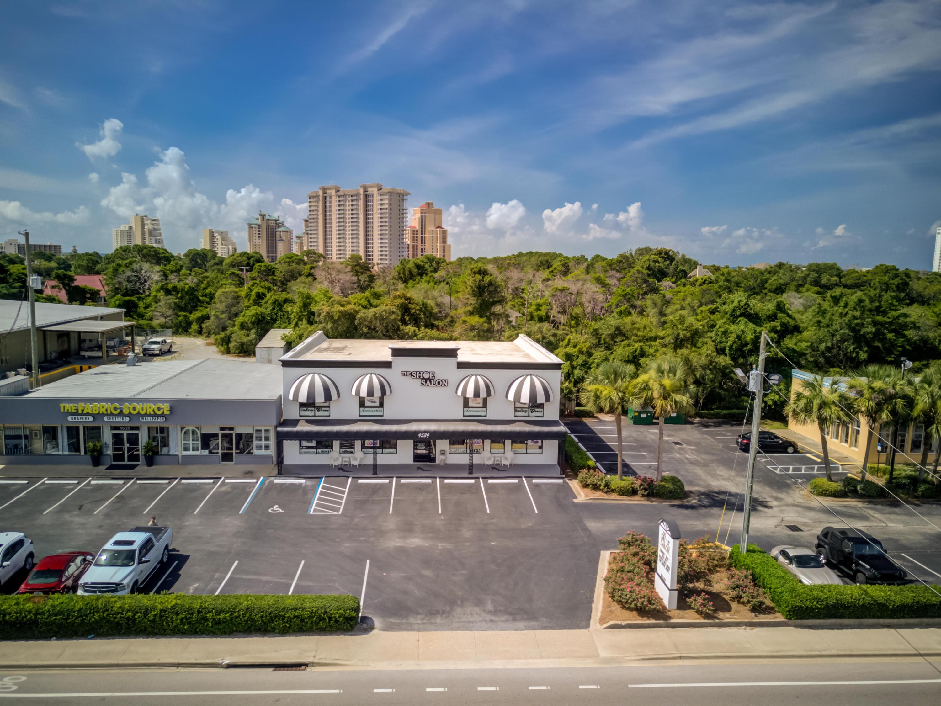 SIGNIFICANT PRICE REDUCTION! Prime commercial site surrounded by the Sandestin Golf & Beach Resort! Various retailing or office configurations could be achieved in this two-story, concrete block building. Currently, one main front entrance serves two floors, both of which have been renovated and clear-spanned for more effective layout and merchandising space. There are currently three bathrooms and one kitchen. Previous uses have included office, retail, and restaurant configurations. The Shoe Salon currently occupies both floors, but will be relocating; thus, a prime vacant opportunity for you to occupy your commercial enterprise, or perhaps redevelop into three smaller suites, thereby converting the storefront into its original state with three points of entry into three demised spaces.
