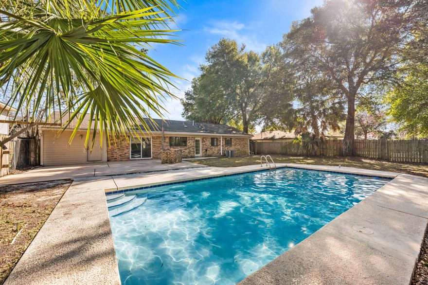 Location, location, location. Owning a home in Destin means living at the center of the Emerald Coast, with shopping, dining, beaches, and entertainment nearby, and convenient access to everything else along the coast.This home offers a functional layout with three bedrooms and two bathrooms. A semi-open kitchen flows into the living and dining areas, creating a comfortable and inviting space, anchored by a wood-burning fireplace that adds warmth and character.And best of all, a private, fenced backyard awaits--featuring a spacious patio and a well-sized pool, creating a hidden outdoor oasis ideal for relaxing and entertaining year-round. Being sold AS-IS, this property is well-suited for a first-time buyer or an investor seeking potential in a highly desirable coastal location.