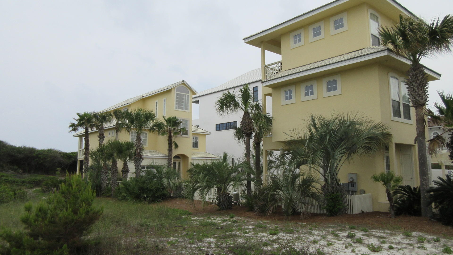 A $200,000 REMODEL ALLOWANCE TO BUYER WITH AN ACCEPTABLE OFFER! THIS LOVELY 3 STORY, 7 BEDROOM, 4 1/2 BATH GULF FRONT HOME & 3 STORY, 2 BEDROOM, 2 1/2 BATH CARRIGE HOUSE IS LOCATED IN THE PRIVATE GATED COMMUNITY OF PARADISE BY THE SEA, SITUATED ON ONE OF THE HIGHEST BLUFFS & OVERLOOKING THE COLORFUL WATERS OF THE GULF OF MEXICO. THIS IS A GREAT INVESTMENT AS A RENTAL PROPERTY OR WOULD BE A NICE LOCATION FOR YOUR PERMANENT OR VACATION HOME. SPECIAL FEATURES INCLUDE; INGROUND POOL, PRIVATE WALKWAY TO THE BEACH, BALCONIES, OPEN & COVERED DECKS, OUTSIDE SHOWER, ELEVATOR, TILE & HARDWOOD FLOORS, CROWN MOULDING, HAND PLASTERED INTERIOR WALLS, SOLID SURFACE CORIAN COUNTER TOPS, AND SO MUCH MORE!!! CONVENIENTLY LOCATED TO CASUAL & FINE DINING, UNIQUE BOUTIQUE SHOPPING, & CHALLENGING GOLF COURSES.