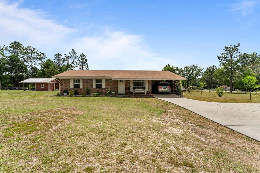 Beautiful one acre fully fenced property on a corner lot with an abundance of fruit trees (fig, apple, pear, plum, loquat and persimmon tree, but let's not forget the olive tree).   The house is in immaculate shape with tile throughout.,with 3 bedroom 2 bathroom and french doors off the Dining Room.  And it doesn't stop there - the laundry room is also an office. The owners replaced the AC in January 2023.  A nice shop for the lawn tools~ Come and look at your future home and see what all it has to offer you.