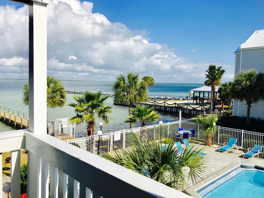 LOOKING FOR A MONEY MAKER OR 2ND HOME W/RENTALS TO OFFSET COSTS? YOU'VE FOUND IT. $37,117 ANNUAL RENTAL INCOME!! Act now to own this BAY FRONT 2 BR/2 Bath condo. Offering a community dock, & gorgeous Bay front pool, AND located directly across the street from the public beach & Beasley Park, boat in the morning & hit the beach with its white sand & crystal blue water in the afternoon! Offering an open floor plan w/laminate flooring, washer/dryer, beautiful furnishings & great Bay & pool views from the deck, this Home is turnkey and ready to go. The condo comes w/reserved parking plus there is an oversized lot for boat trailers.Located in the heart of Okaloosa Island, great restaurants, the beach & Aquarium are close by. Enjoy the beauty of waterfront living at an unbelievable price.