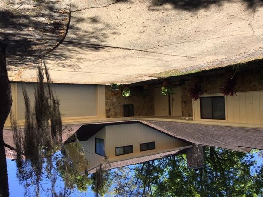 Spacious 4 bedroom 3 bath home with an office on the water(no dock),large den with fireplace